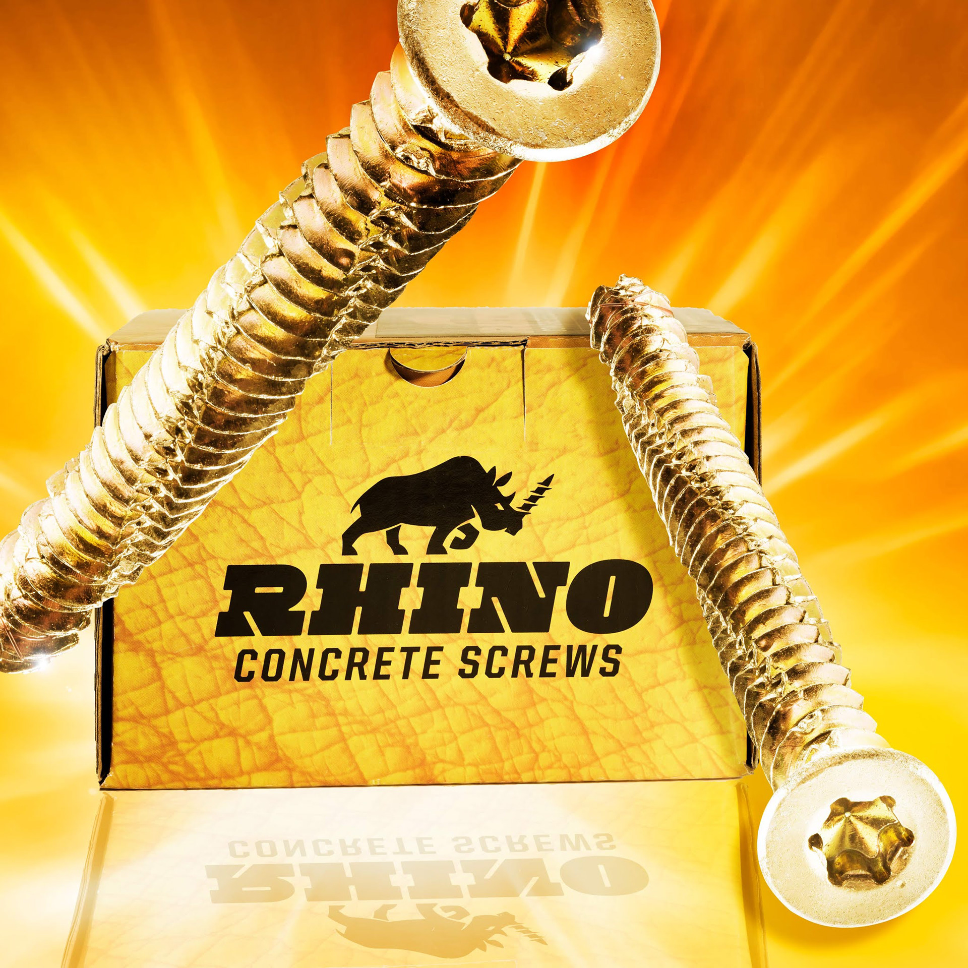 A box of "Rhino Concrete Screws" with two large screws in front, set against a dynamic orange background, conveying strength and durability. product photographers in west midlands .
