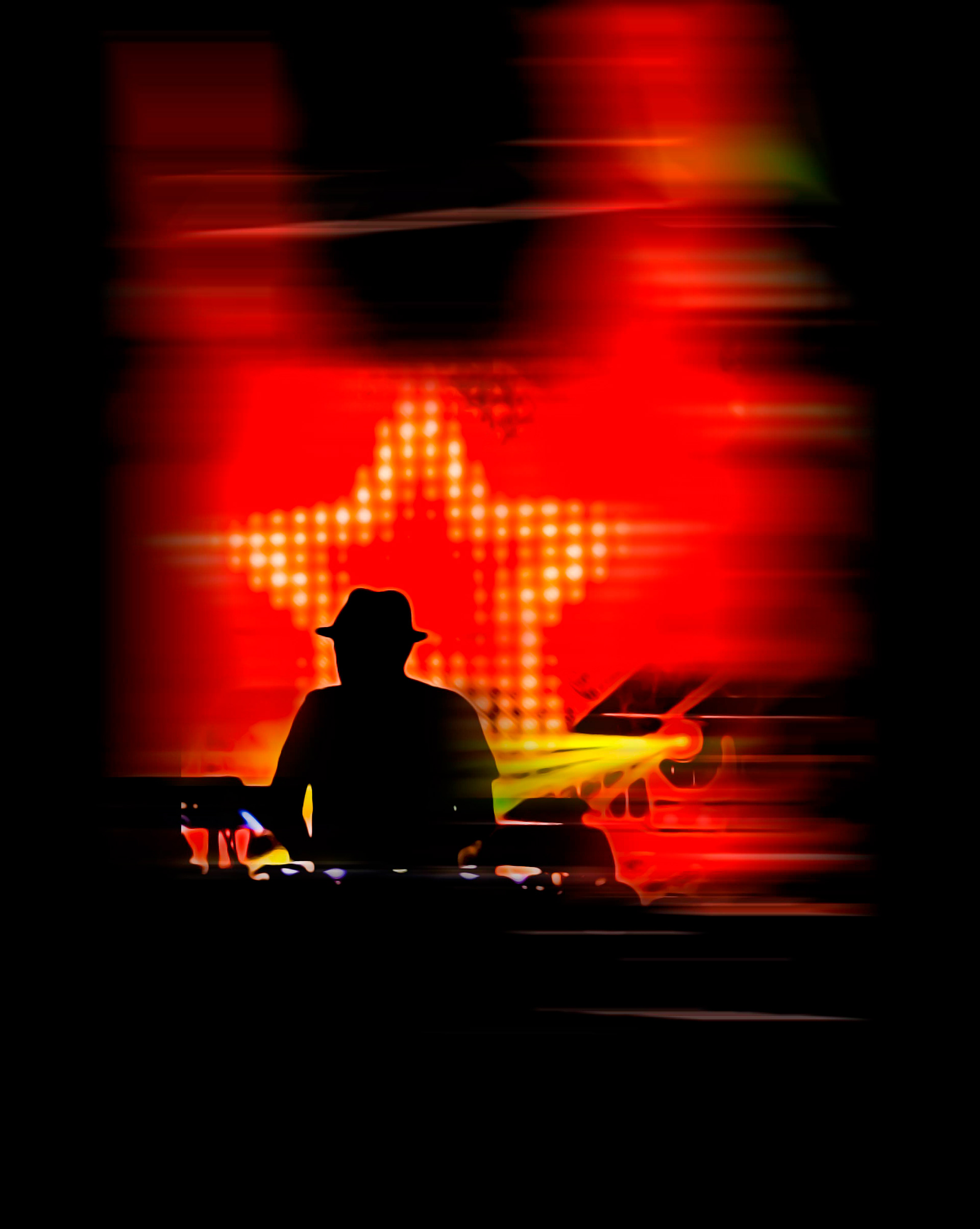 Silhouette of a person wearing a hat, DJing against a vibrant red background with a glowing star pattern and dynamic yellow light beams. Energetic atmosphere.