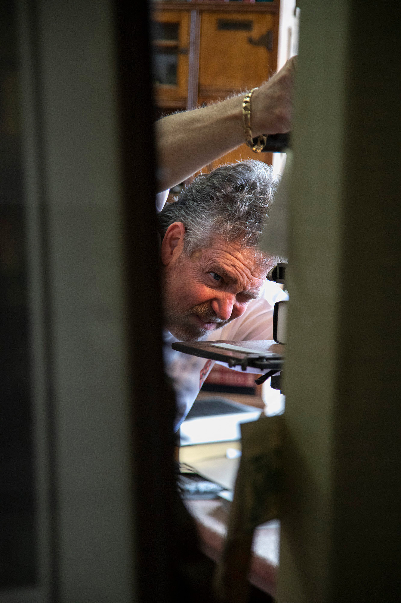 Skip Bowman presses words into the cover of a book for students at Ohio Christian University as he chats with them about the Circleville Pumpkin Festival. At Beck and Orr, cover imprinting is often done as a walk-in service as it takes no more than a few minutes.