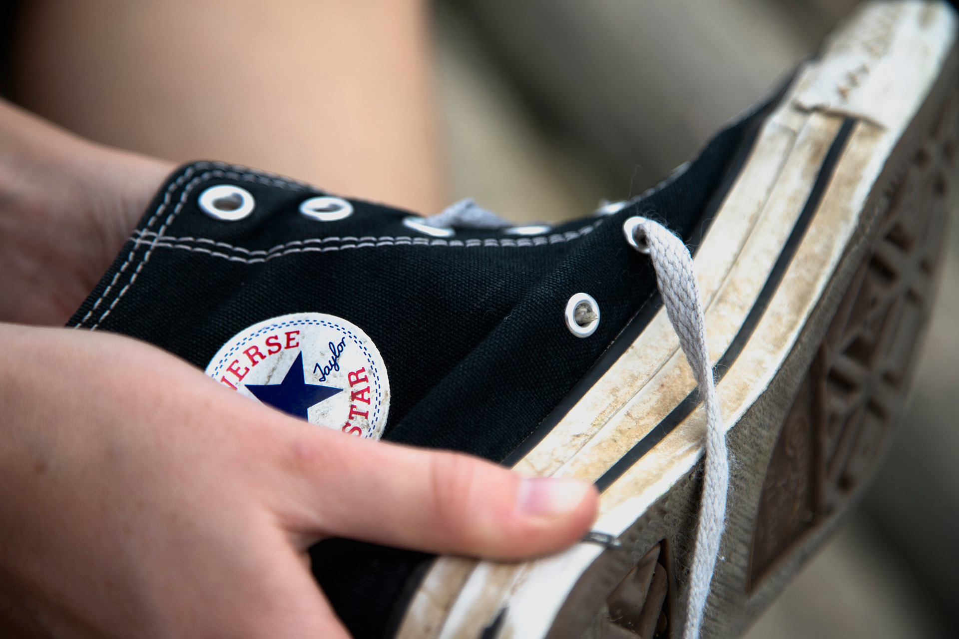 Maggie Bennink attempts to show me how to properly tie her Converse as it states in the patent before going for a walk.