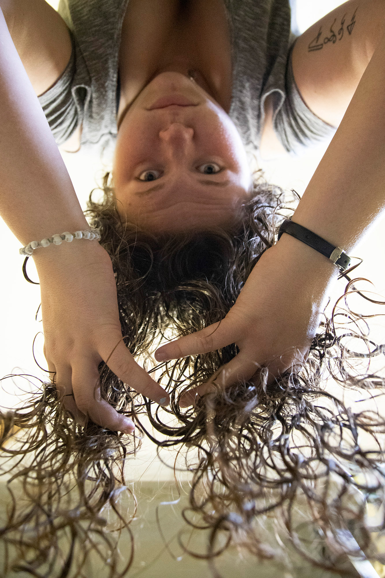 I scrunch my hair in my bathroom after showering and putting product in to enhance the curls and make it less frizzy.