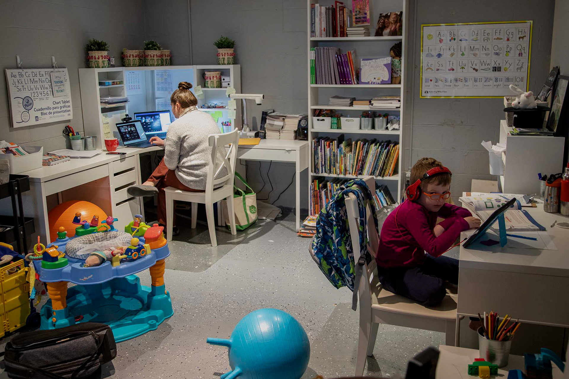 Rachel Concitis has set up a desk for herself and her 5 year old son, Bradley in their basement so that she can keep an eye on him as he goes through Kindergarten. Concitis “loves the 30 second commute” that comes with online teaching.