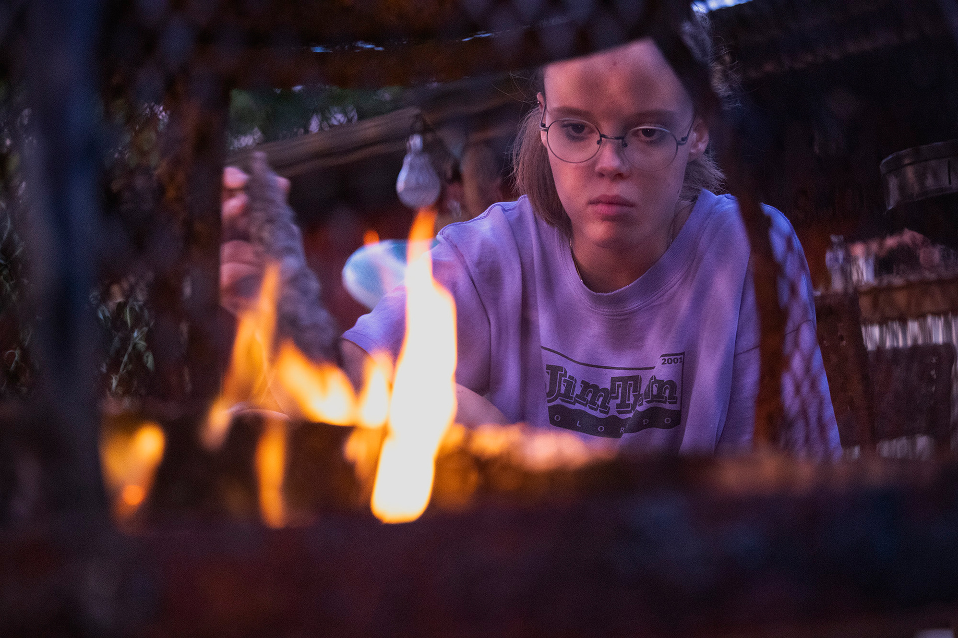 Maggie Bennink tends to a fire in Toledo, Ohio, while visiting friends. Bennink says she loves playing with fire and will do so any chance she gets.
