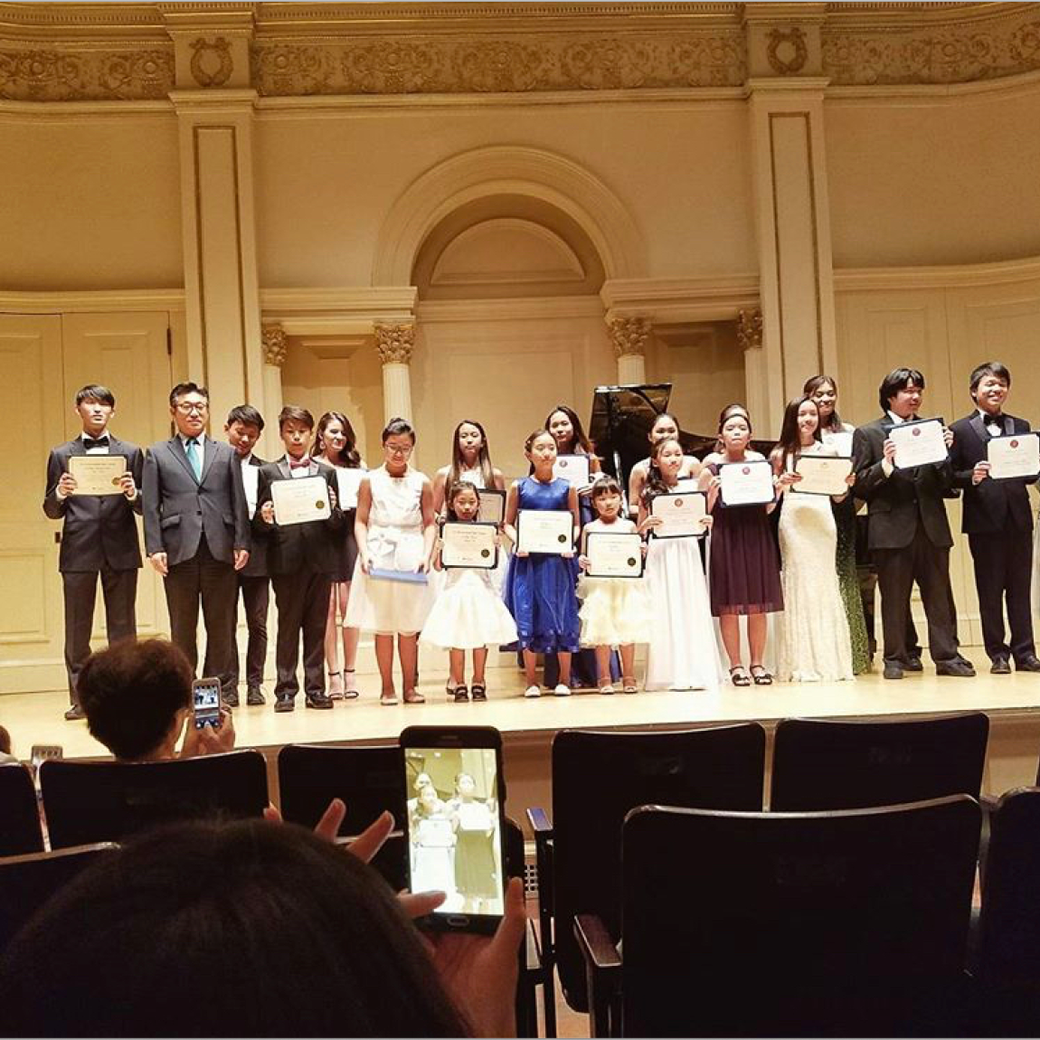 Can you see me? I'm in the back, center-left, holding my 1st place certificate after winning a national music competition and being honored with a recital in Carnegie Hall. I played Jeux D'eau, by Maurice Ravel.