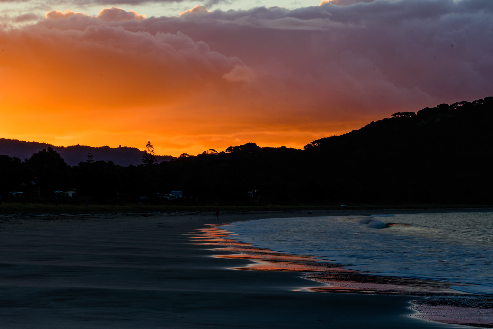 Fiery sunset at Cooks Beach, New Zealand
