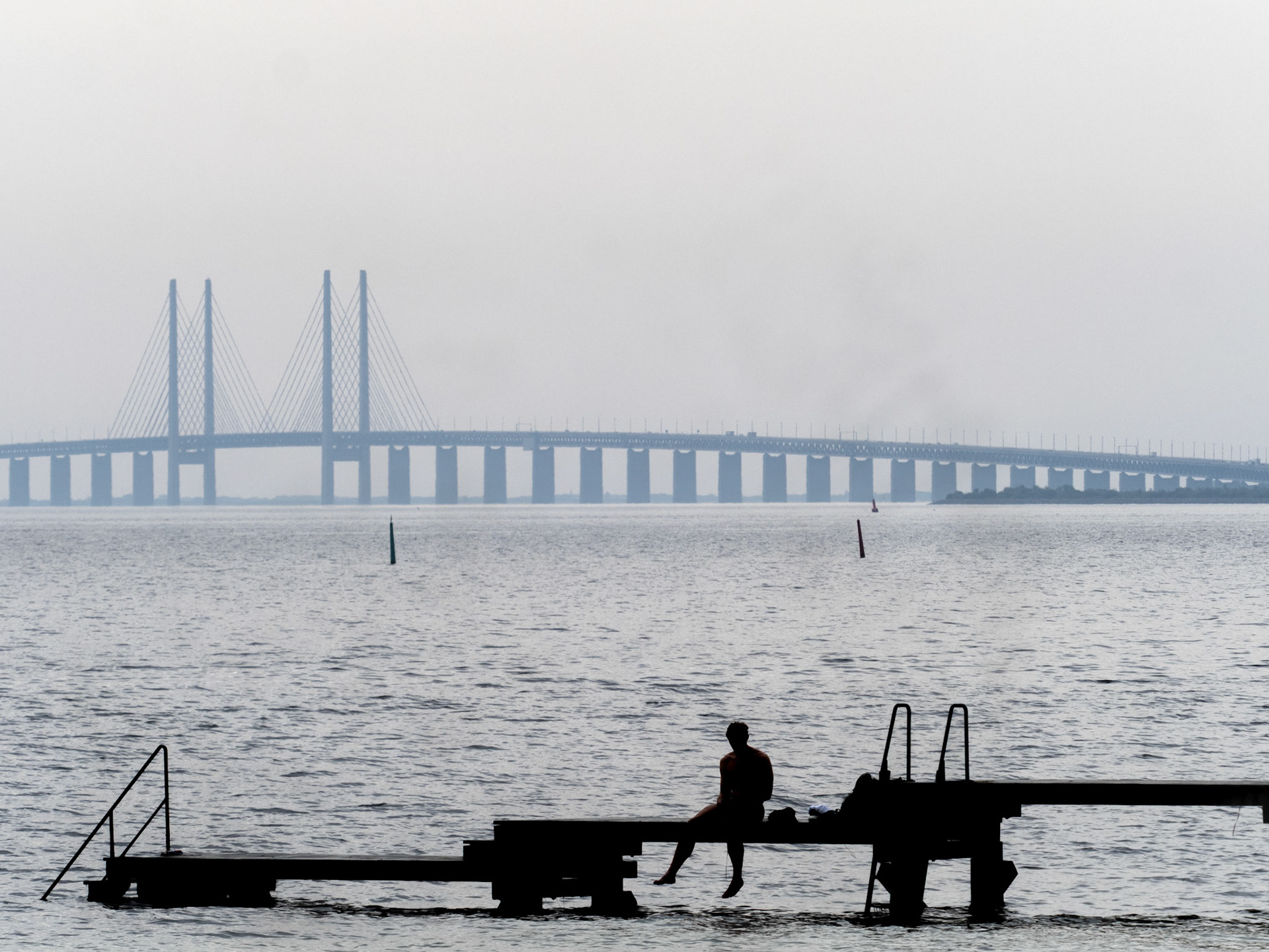Øresund sea and bridge with bathing bridge in the foreground