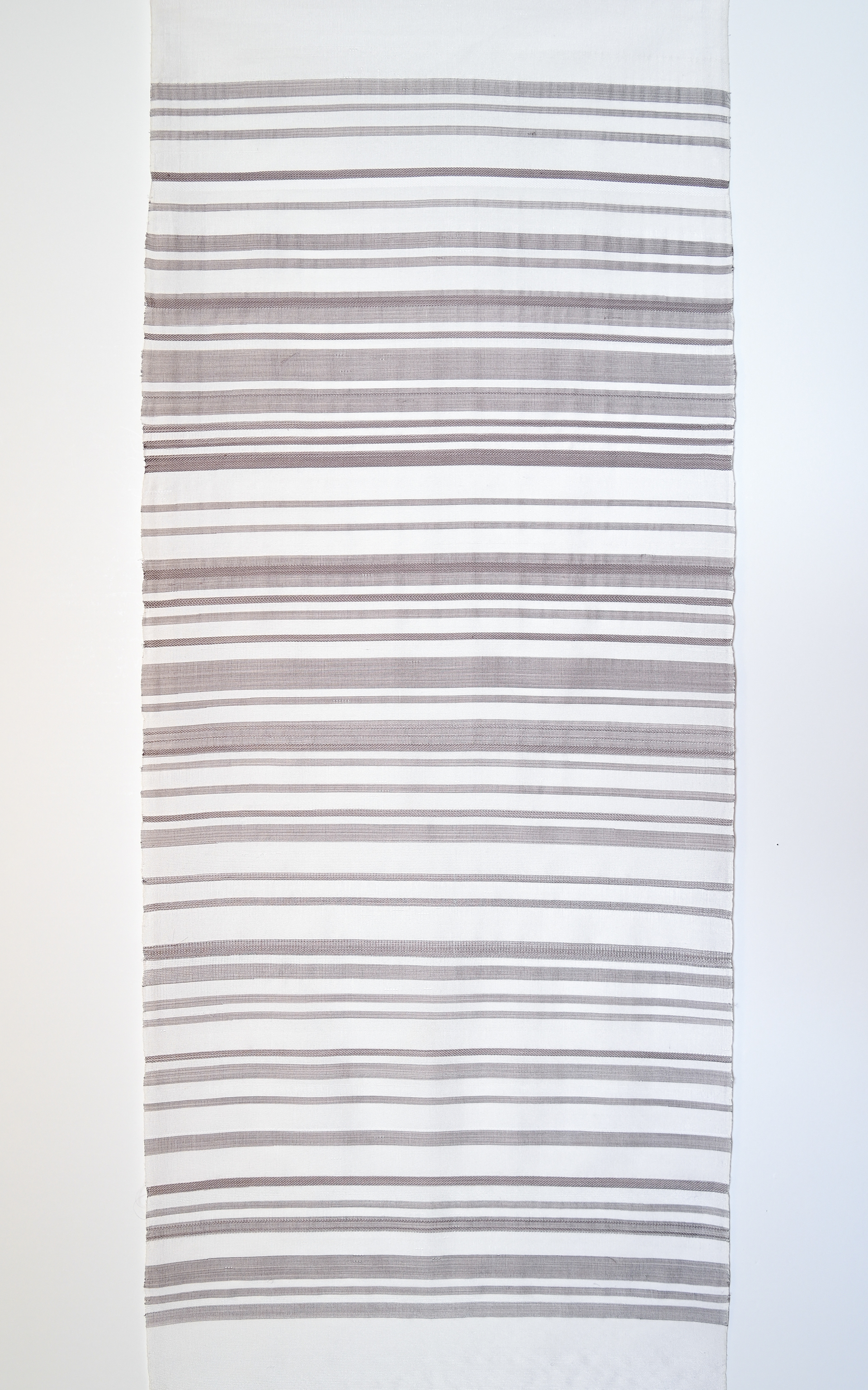 Comfort, 2026; raw, machine-spun silk, dyed with areca nut 80 cm x 34.5 cm