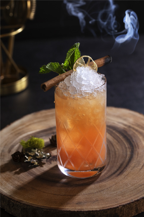 Grogan's Mill craft cocktail: light rum, dark rum, rye whiskey & disaronno amaretto shaken with guava purée & citrus, served with a smoking cinnamon stick.