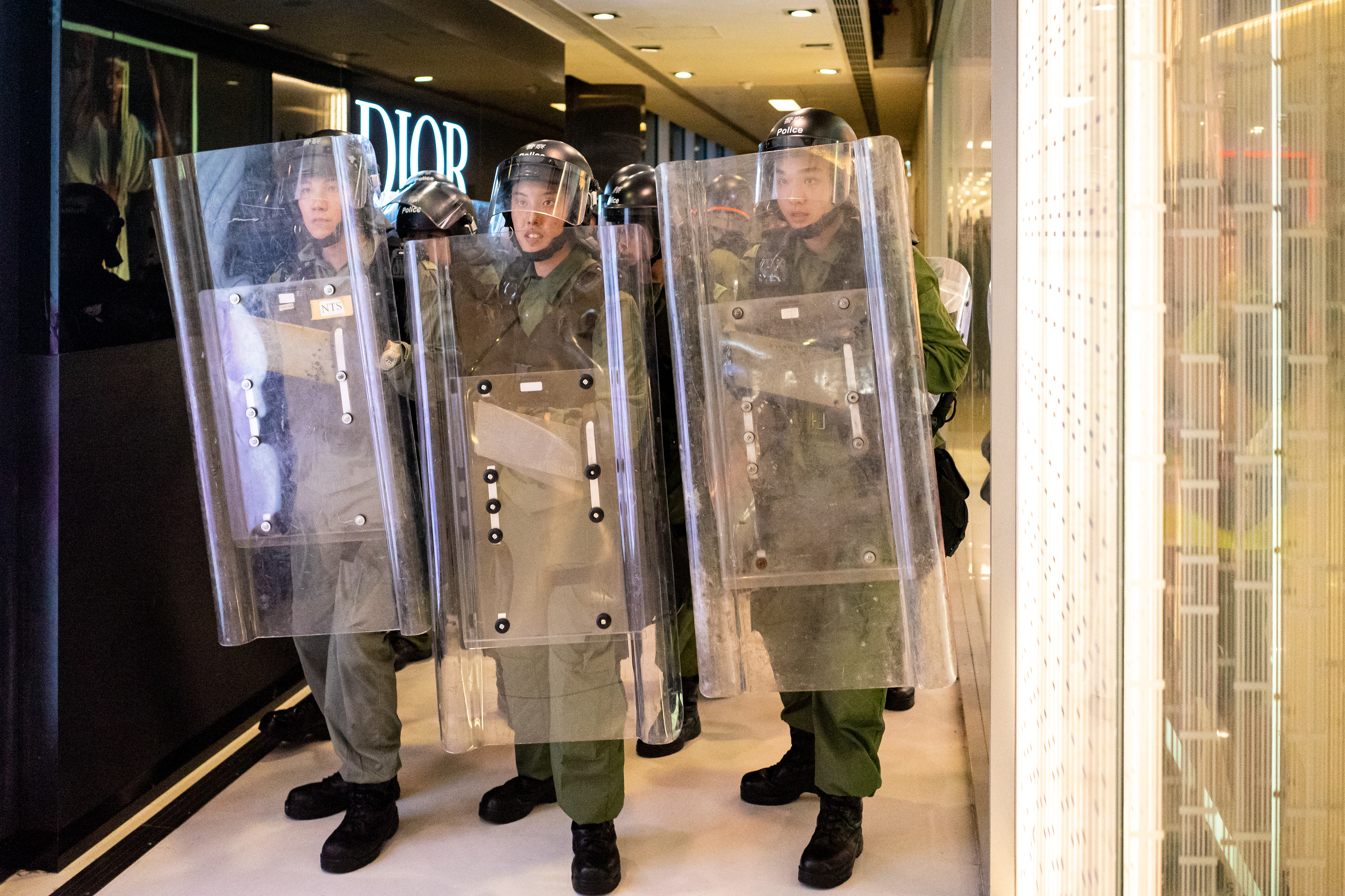 Just minutes after the first small group of police are driven from the mall, Riot Police enter setting of hours of violence and injuries to protestors and police alike. A protest in the Sha Tin suburb of Hong Kong was largely peaceful, until police pursued protestors into the New Park Mall. July 14, 2019-Hong Kong