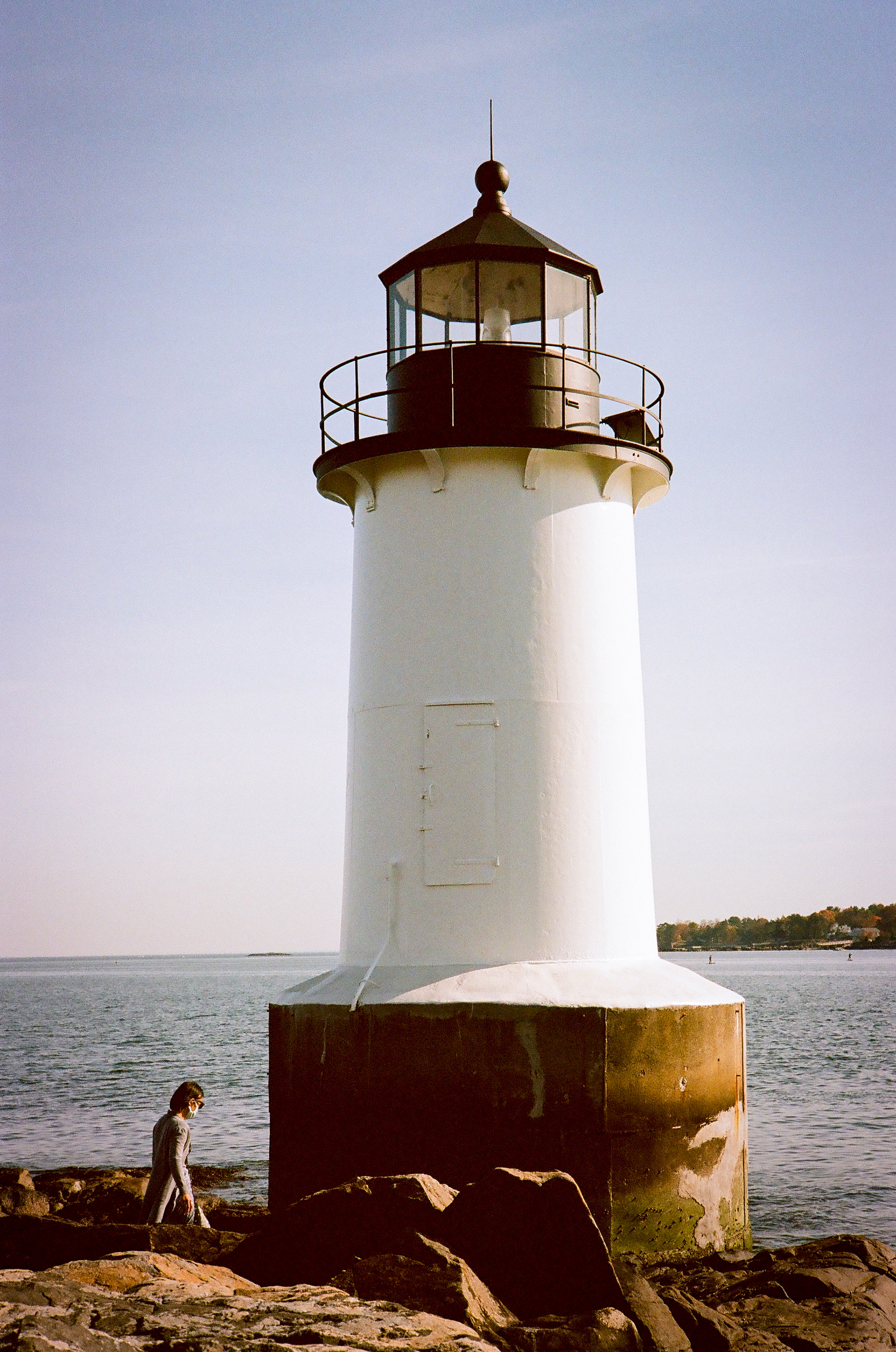Salem Lighthouse: Ceci exploring the shoreline and lighthouse at Winter Island in Salem, Mass. November 2020-Salem, MA-Photo by Aaron Guy Leroux