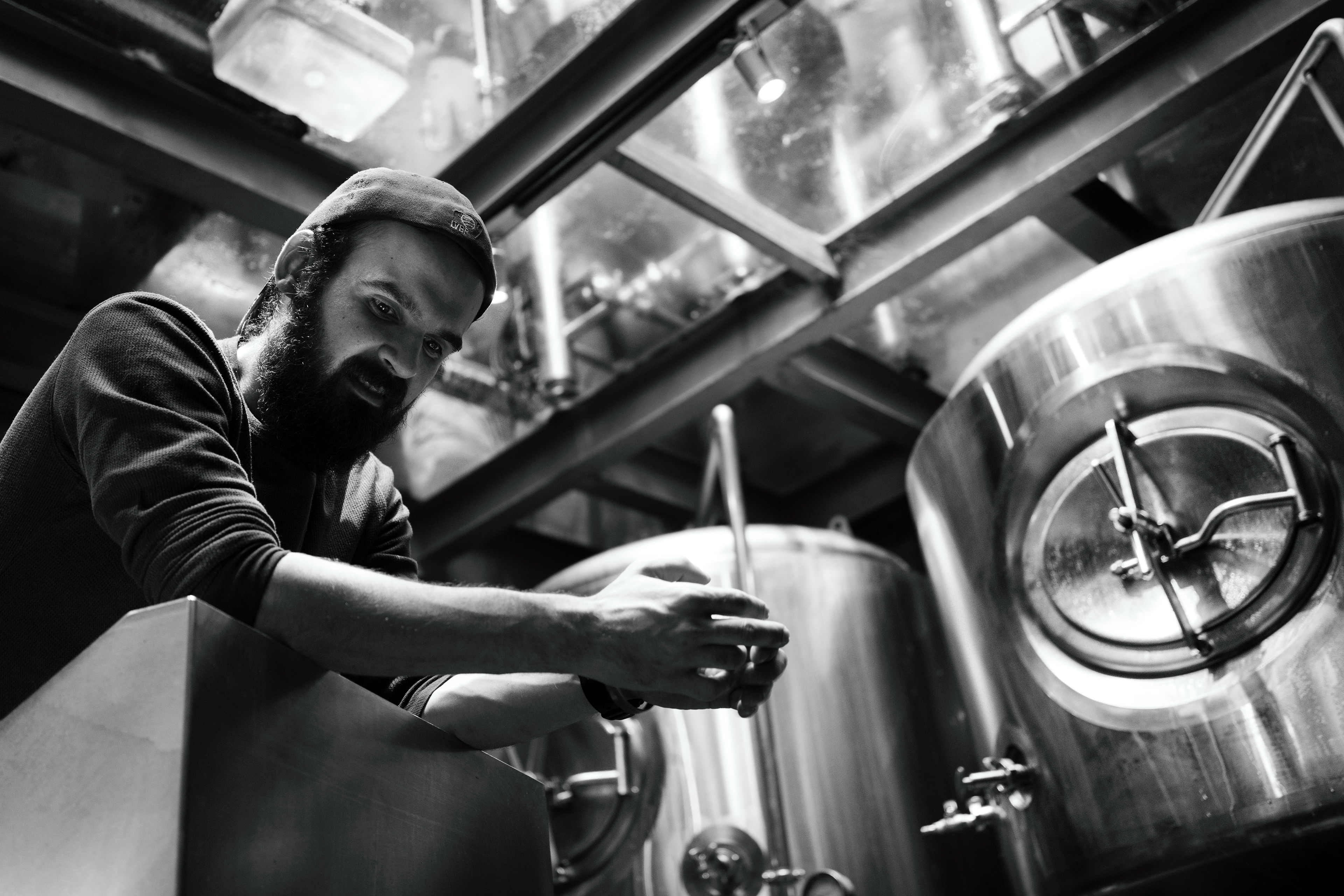 Hector waiting for the signal to pump the beer upstairs into the fermenter.