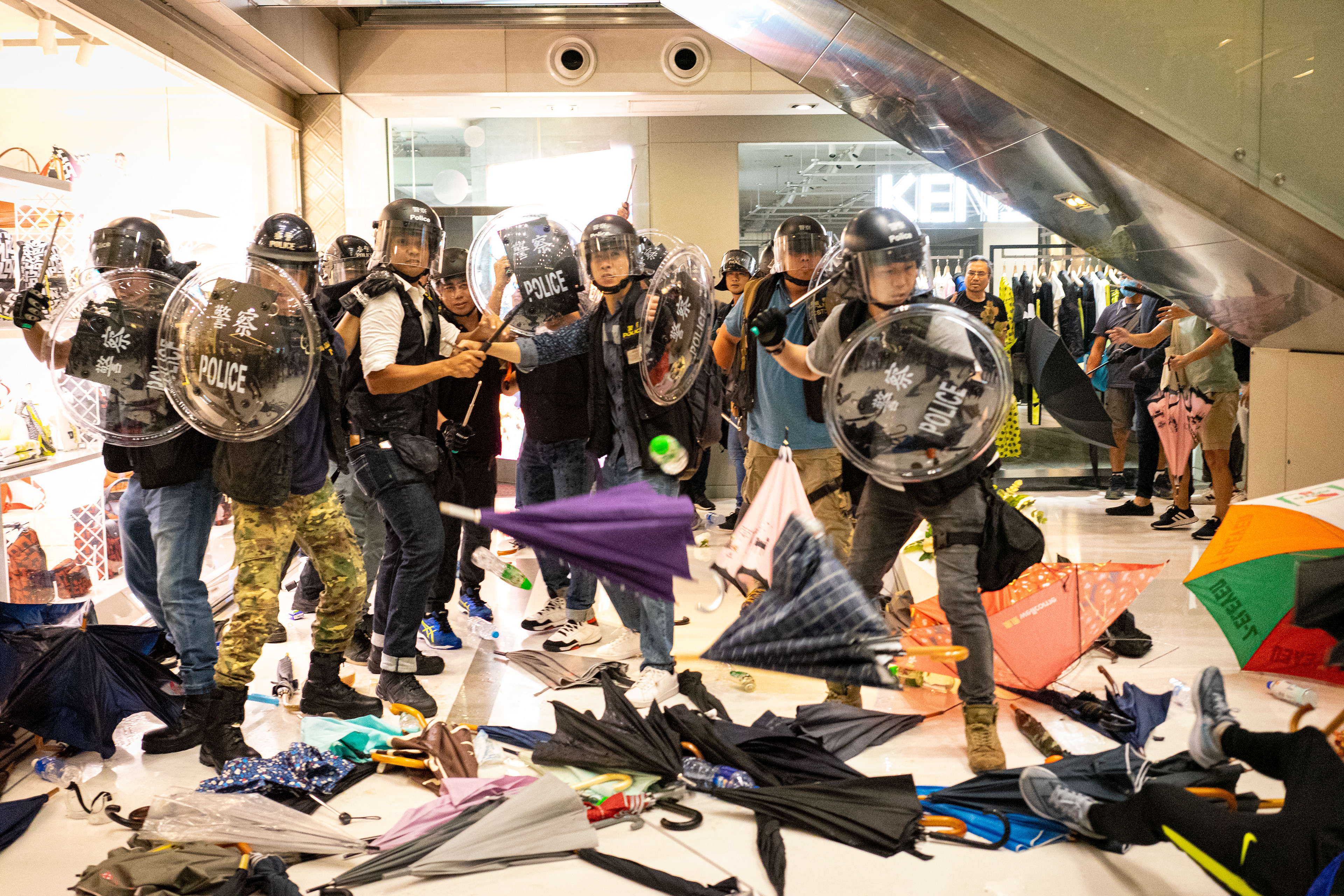 Despite the reaction to their presence, the cadre of officers, who are wildly outnumbered, seem in no rush to leave. Even as they are pushed back towards the stairwell they entered the mall from. A protest in the Sha Tin suburb of Hong Kong was largely peaceful, until police pursued protestors into the New Park Mall. July 14, 2019-Hong Kong