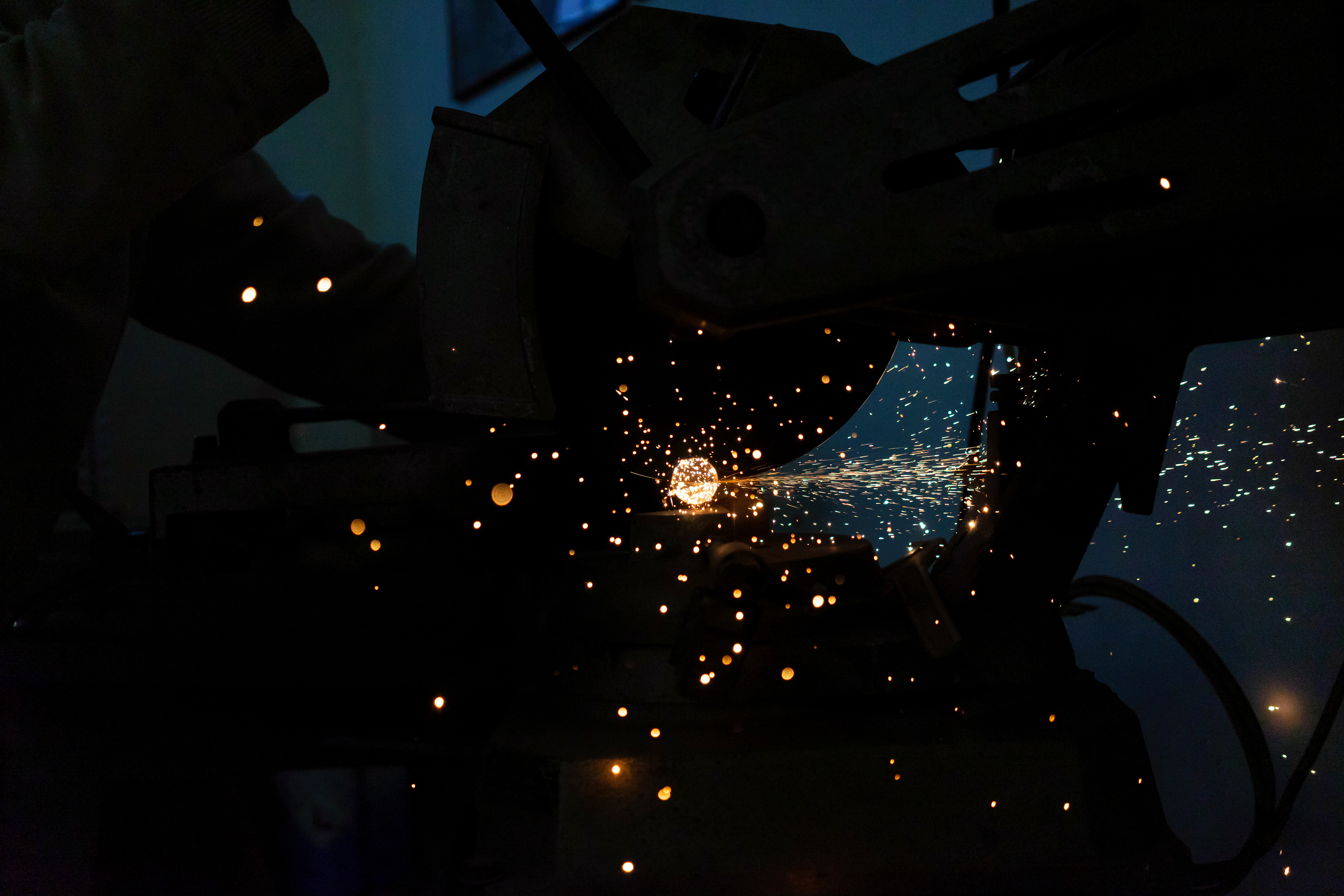 2: Sparks Fly -As Gianmaria Citron, apprentice frame builder, cuts more steel, I watch the sparks fly all over the room.