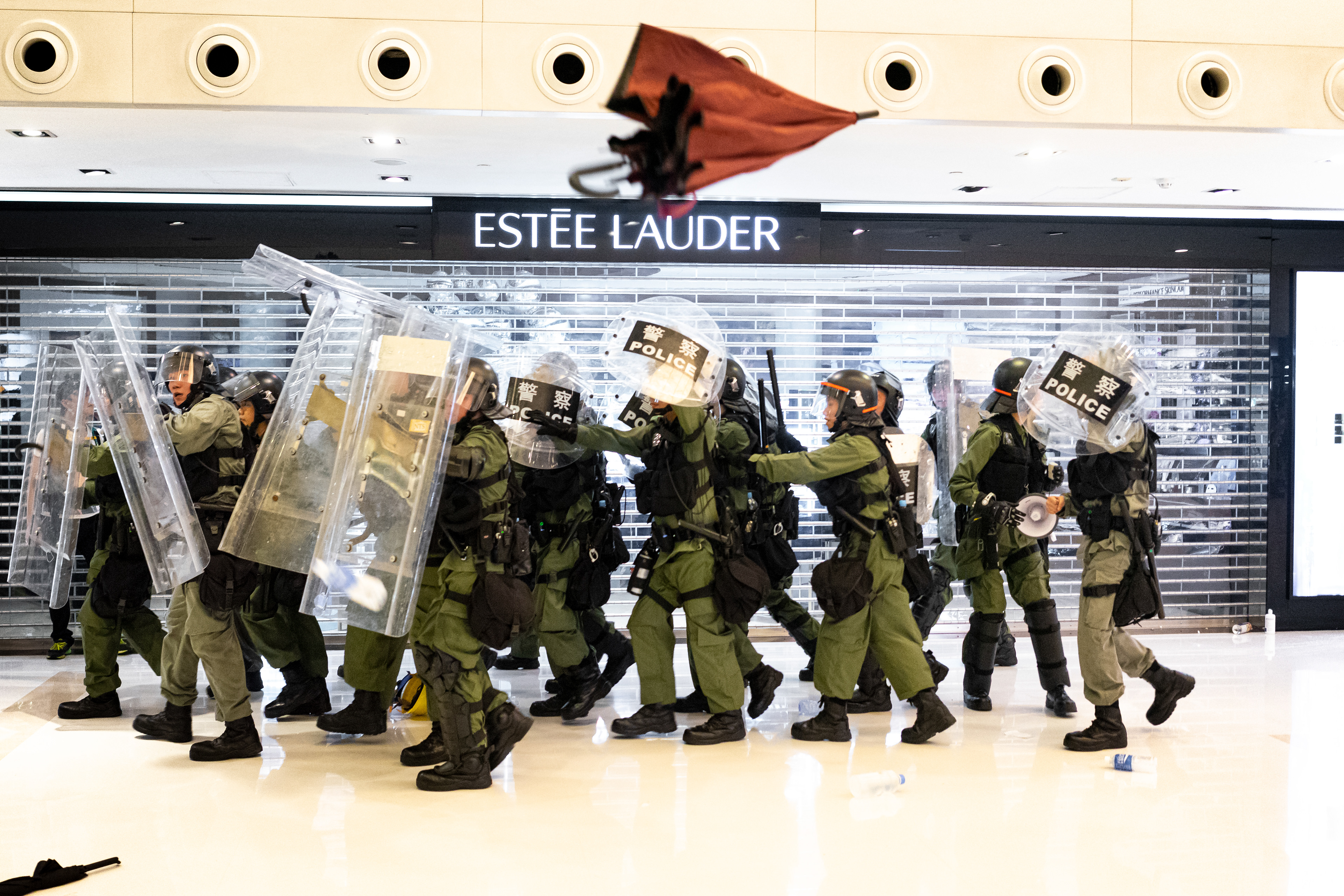 Groups of Riot Police enter the mall from every direction, trapping protestors inside. A protest in the Sha Tin suburb of Hong Kong was largely peaceful, until police pursued protestors into the New Park Mall. July 14, 2019-Hong Kong