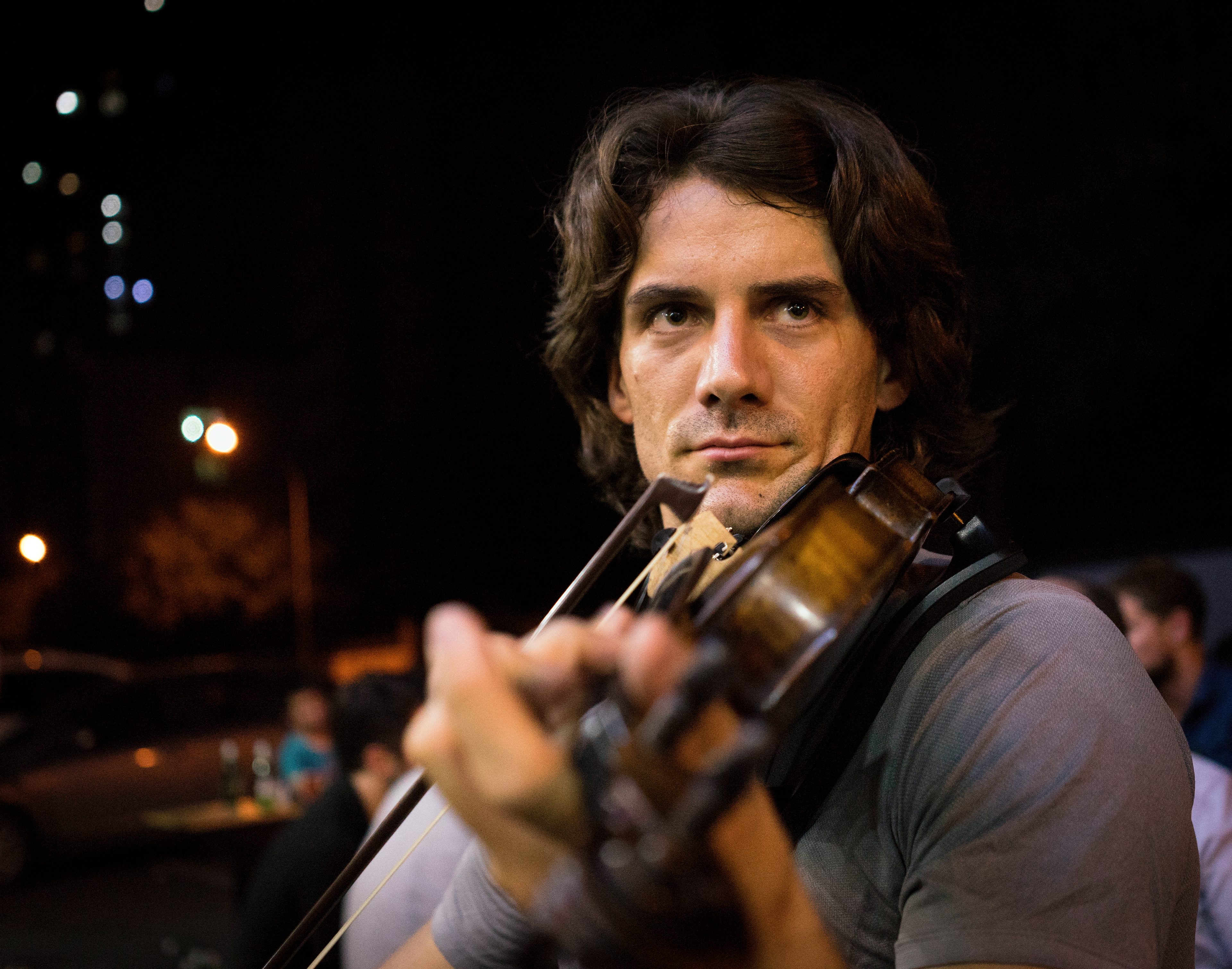 Jake: An expat teacher here for the XJTU summer program plays his violin on the sidewalk, as many gallons of beer are imbibed all around him. I've seen much more public playing of the violin here than I ever anticipated.