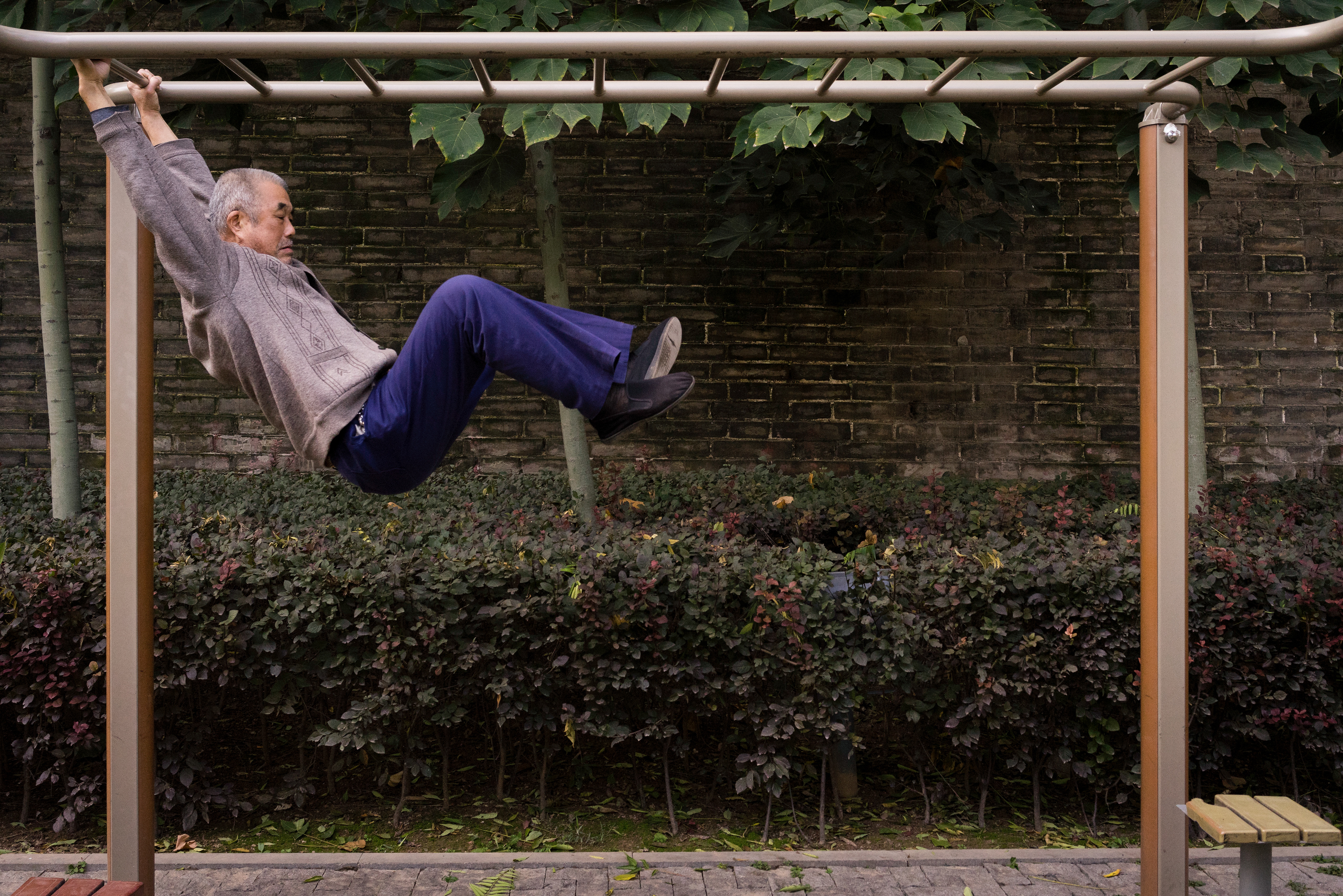 A Chinese man works his daily exercise routine.
