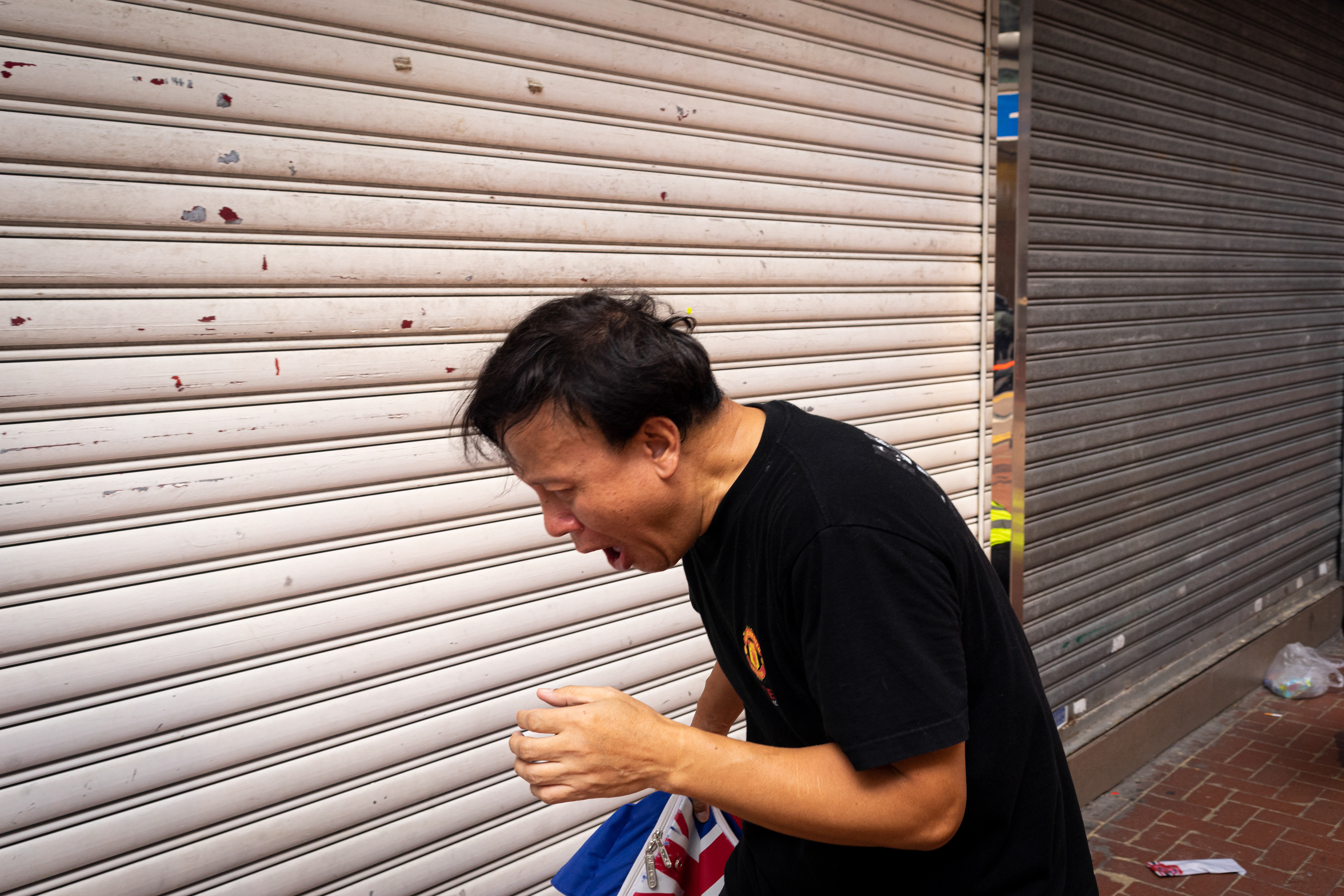 Hurting: Causeway Bay, Hong Kong: The sudden deployment of tear gas catches many citizens simply passing by or working in local shops, utterly unprepared. Following the 5th anniversary of the Umbrella Movement, protesters encounter violence from police on a scale that has not been seen before. September 29, 2019-Hong Kong