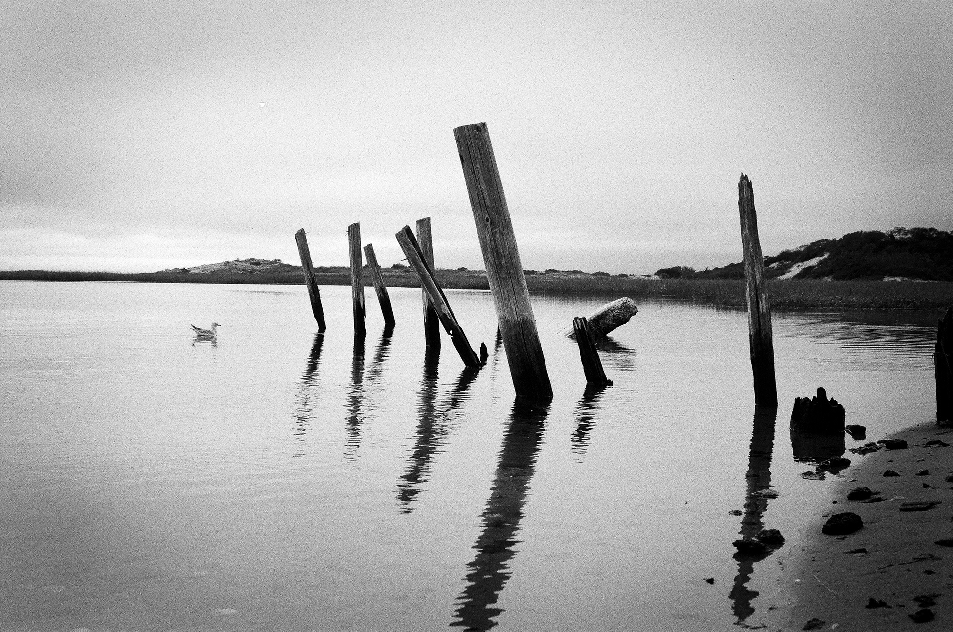 Provincetown: A calm bit of water behind a large stone seawall on the northern tip of Provincetown. September 25, 2021-Provincetown-Photo by Aaron Guy Leroux