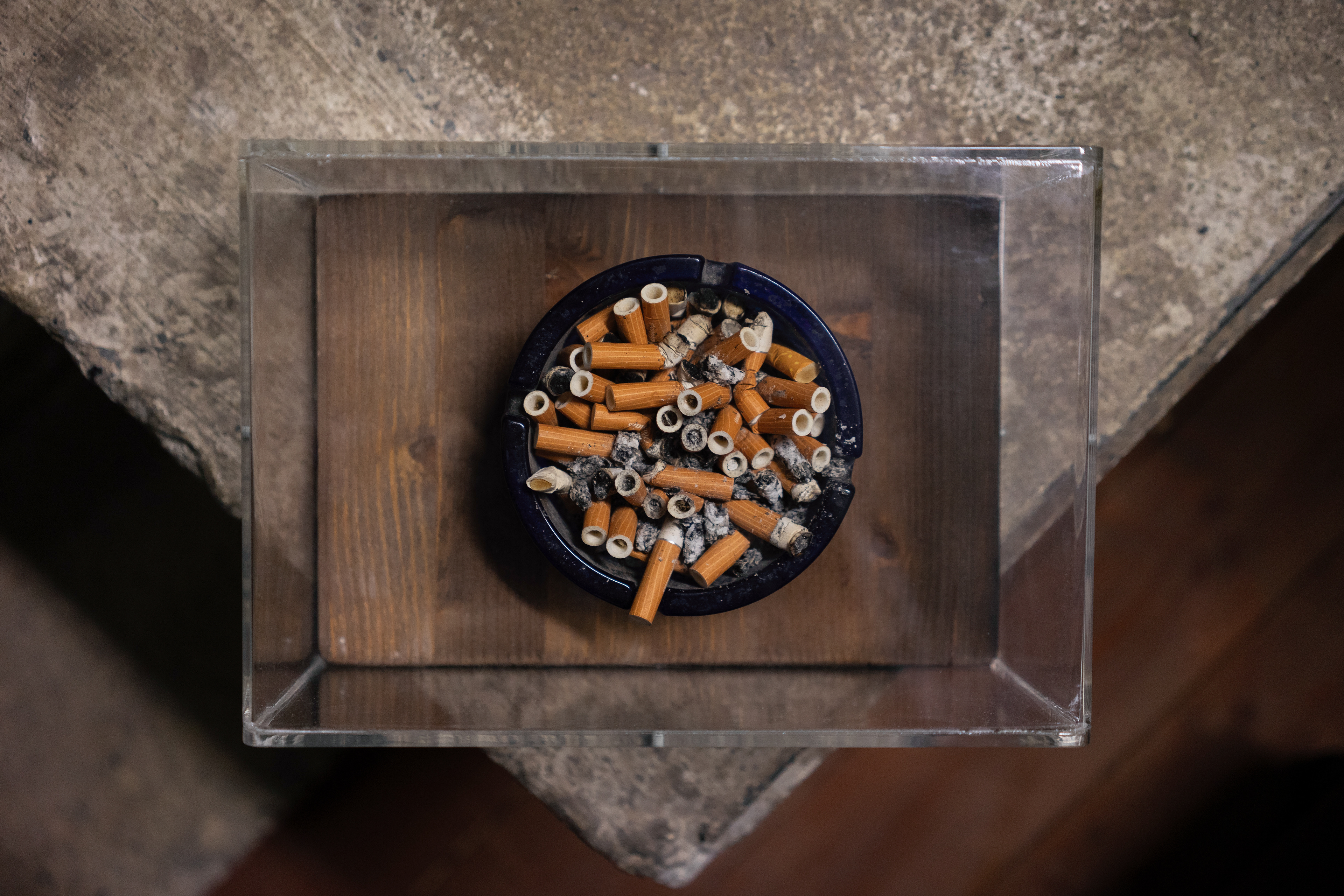12: Dario's Last Day -The cigarette butts from Dario's last day of smoking. After his death, Cristina couldn't bear to throw them away. A friend of the workshop built a case, and the ashtray sits in "The Pit," the workshops living room, to this day.