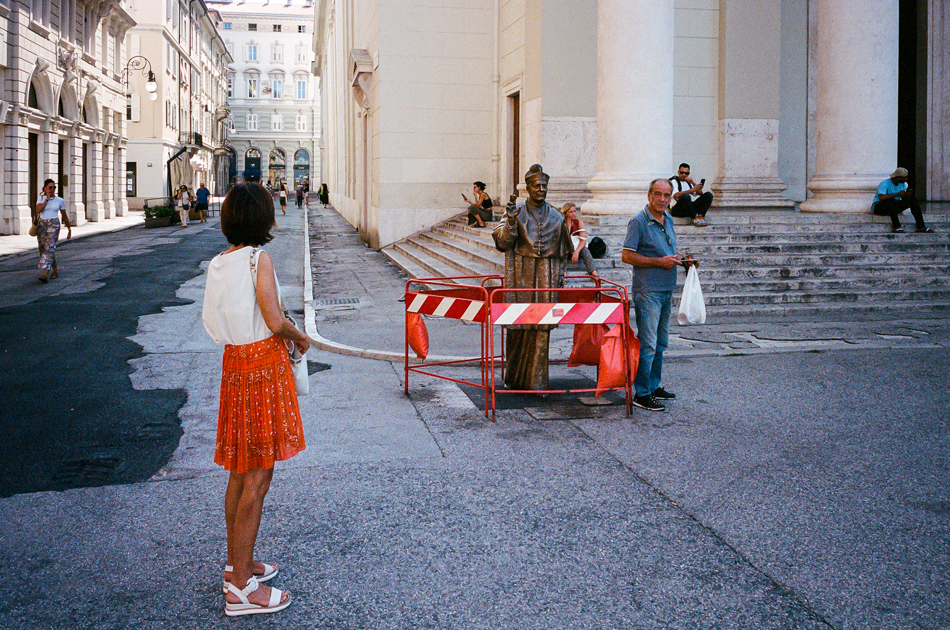 Beware - An oddly cordoned off bronze statue in the center of Trieste. Photo by - Aaron Guy Leroux - August, 2024 - Torino, Italy