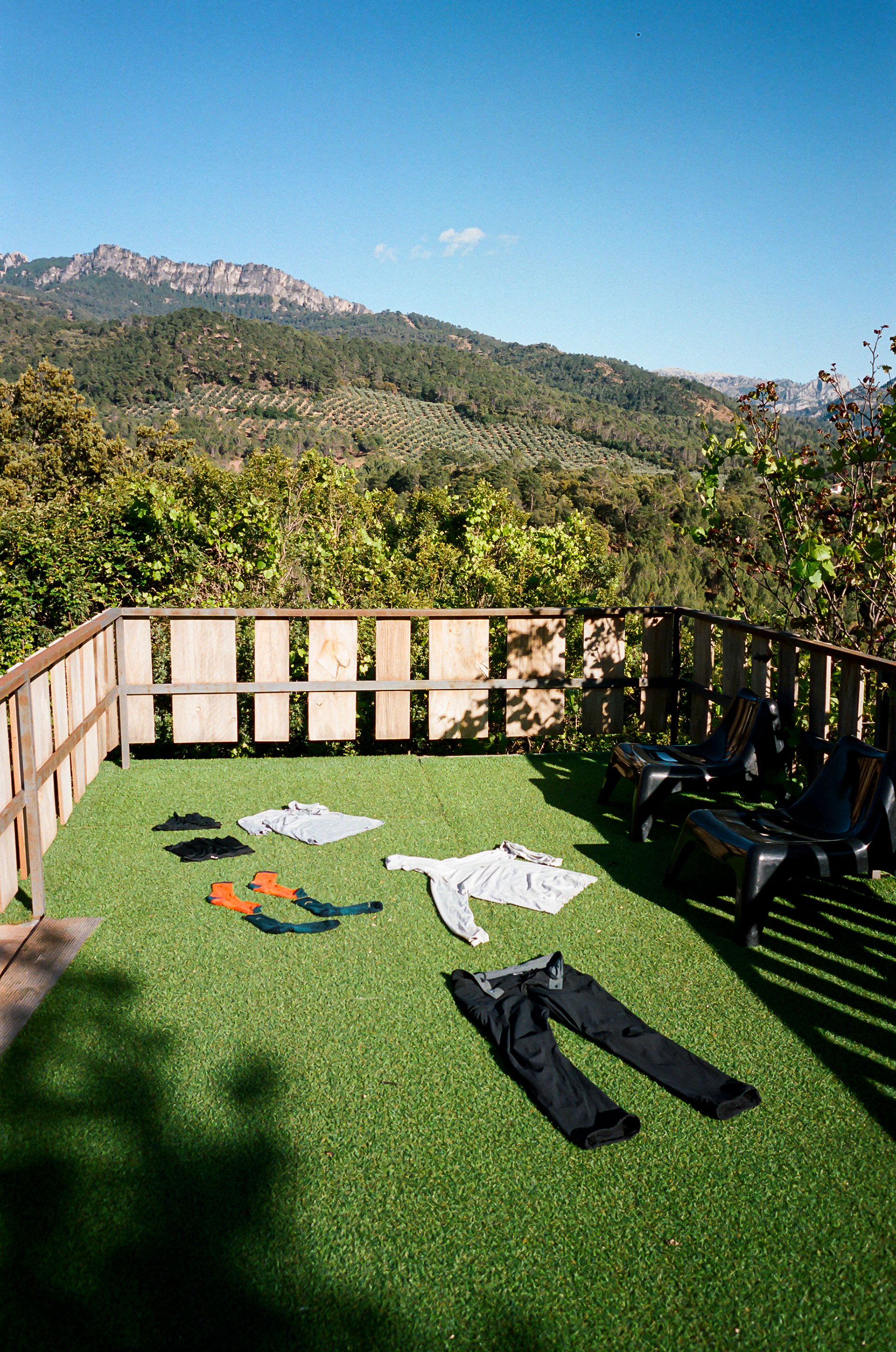 Laundry Day - At the end of a long day I arrived at the Hotel Montaña. Standing alone on a small hill on the outskirts of Coto Rios, Spain I arrived to find a completely empty establishment, save for one employee awaiting my arrival. I did my laundry in the sink of my room and laid my clothes out on a sundeck near an empty swimming pool. Another day in the books. Photo by - Aaron Guy Leroux - April, 2024 - Coto Rios, Spain