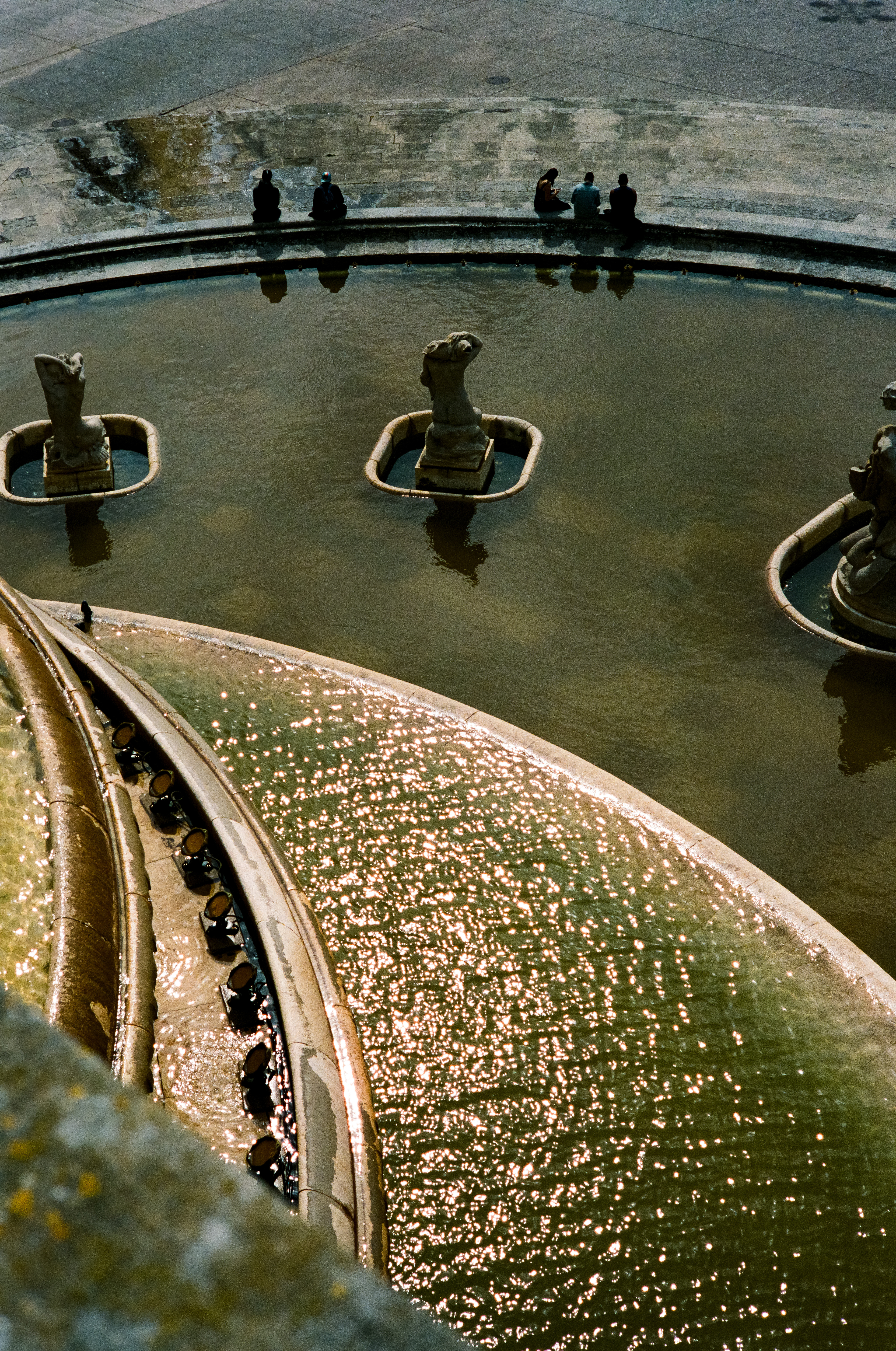 Monumental 1940 fountain in a park, with sculptures of Triton & mermaids, plus evening light shows. March 30, 2023-Lisbon, Portugal-Photo by Aaron Guy Leroux