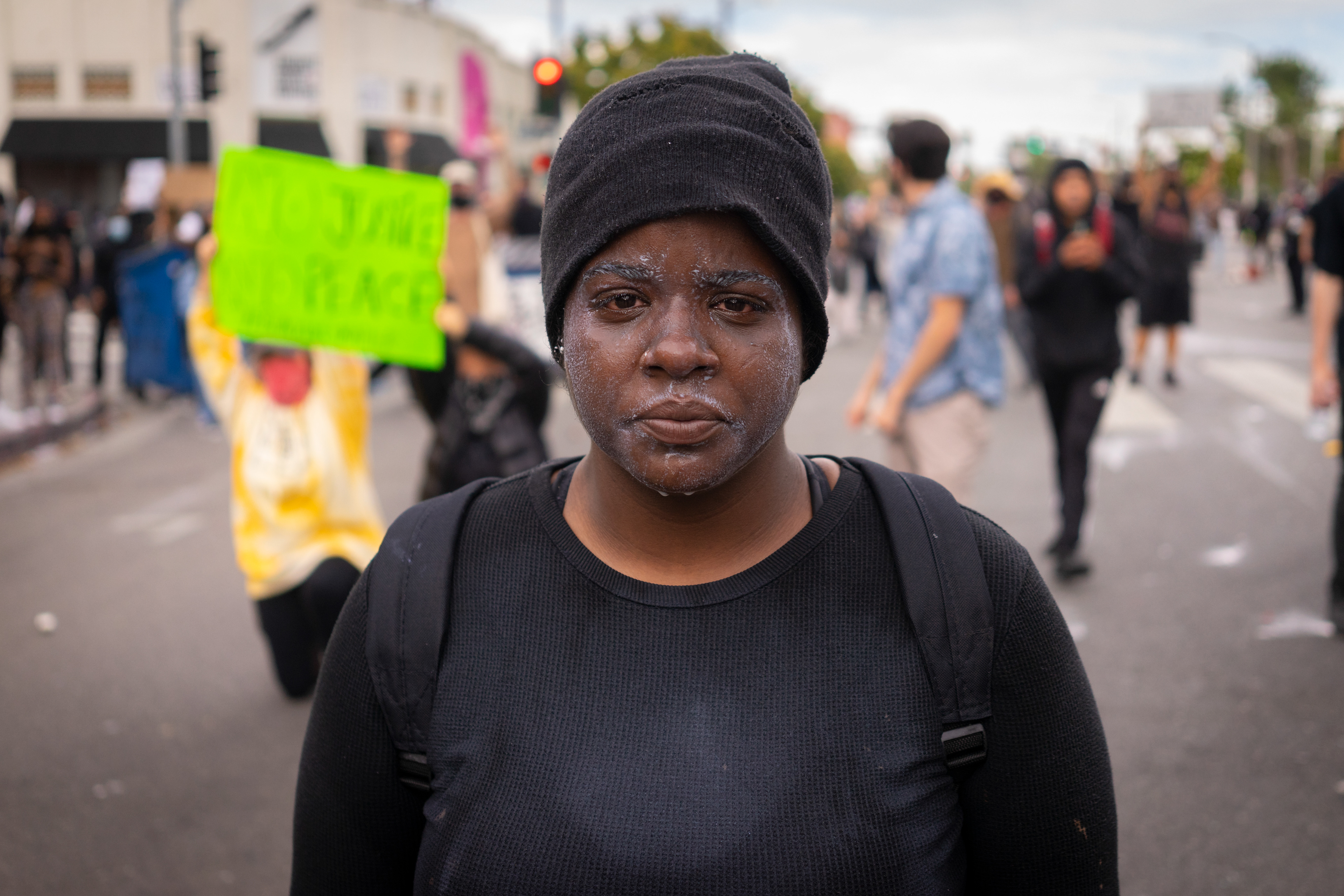 Milk & Tears: Fairfax, Los Angeles: Akasia, 24 years old, a native of Los Angeles washed out her eyes with milk after being tear-gassed by riot police. Angelinos took to the streets to protest continued police violence and murder in the wake of George Floyd's murder by Minnesota Police on May 25th. May 30, 2020-Los Angeles-Photo by Aaron Guy Leroux/ Sipa USA