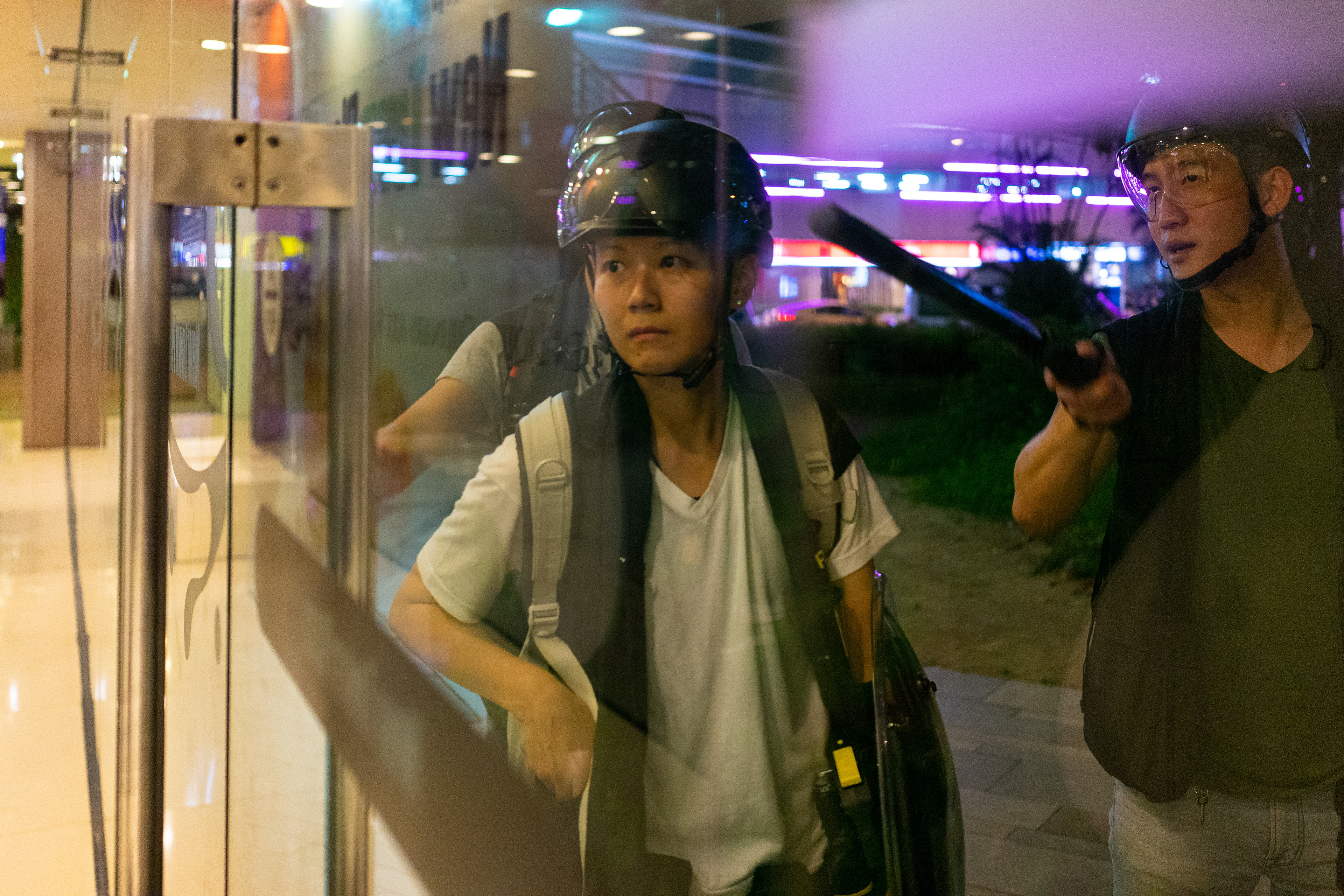 As the streets are cleared, protestors file peacefully into the New Park Mall. Police wait outside. Inside the mall is an MTR station which will allow protestors to make their way home. A protest in the Sha Tin suburb of Hong Kong was largely peaceful, until police pursued protestors into the New Park Mall. July 14, 2019-Hong Kong