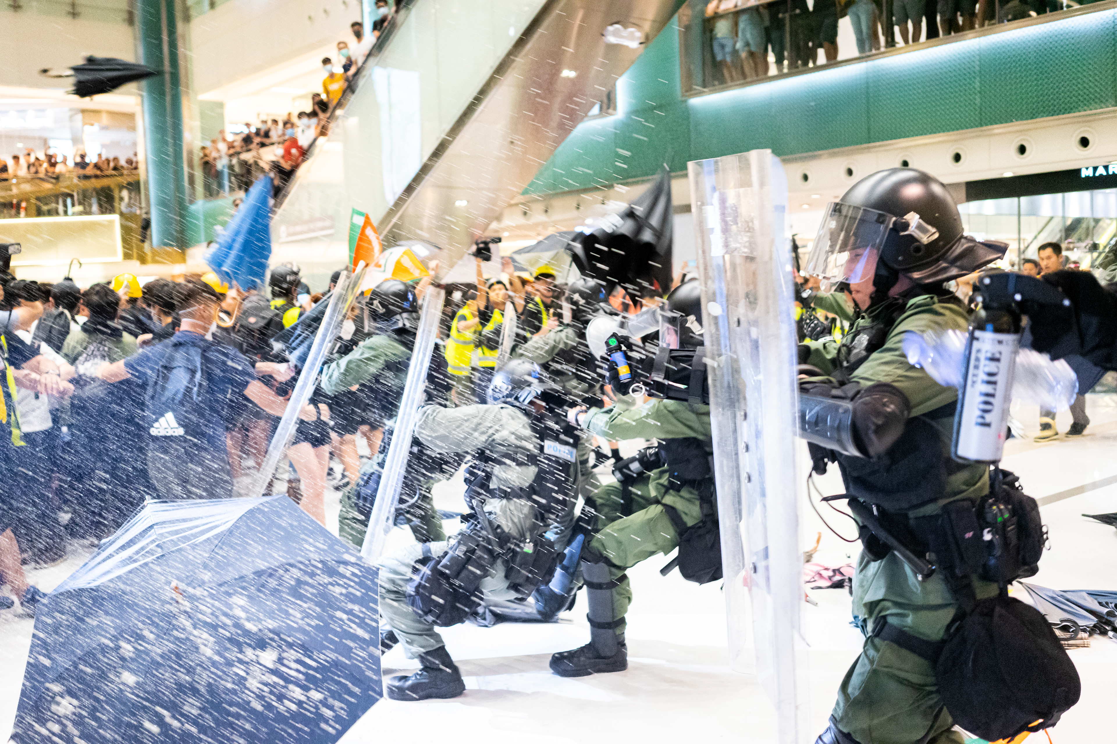 Groups of Riot Police enter the mall from every direction, trapping protestors inside. A protest in the Sha Tin suburb of Hong Kong was largely peaceful, until police pursued protestors into the New Park Mall. July 14, 2019-Hong Kong