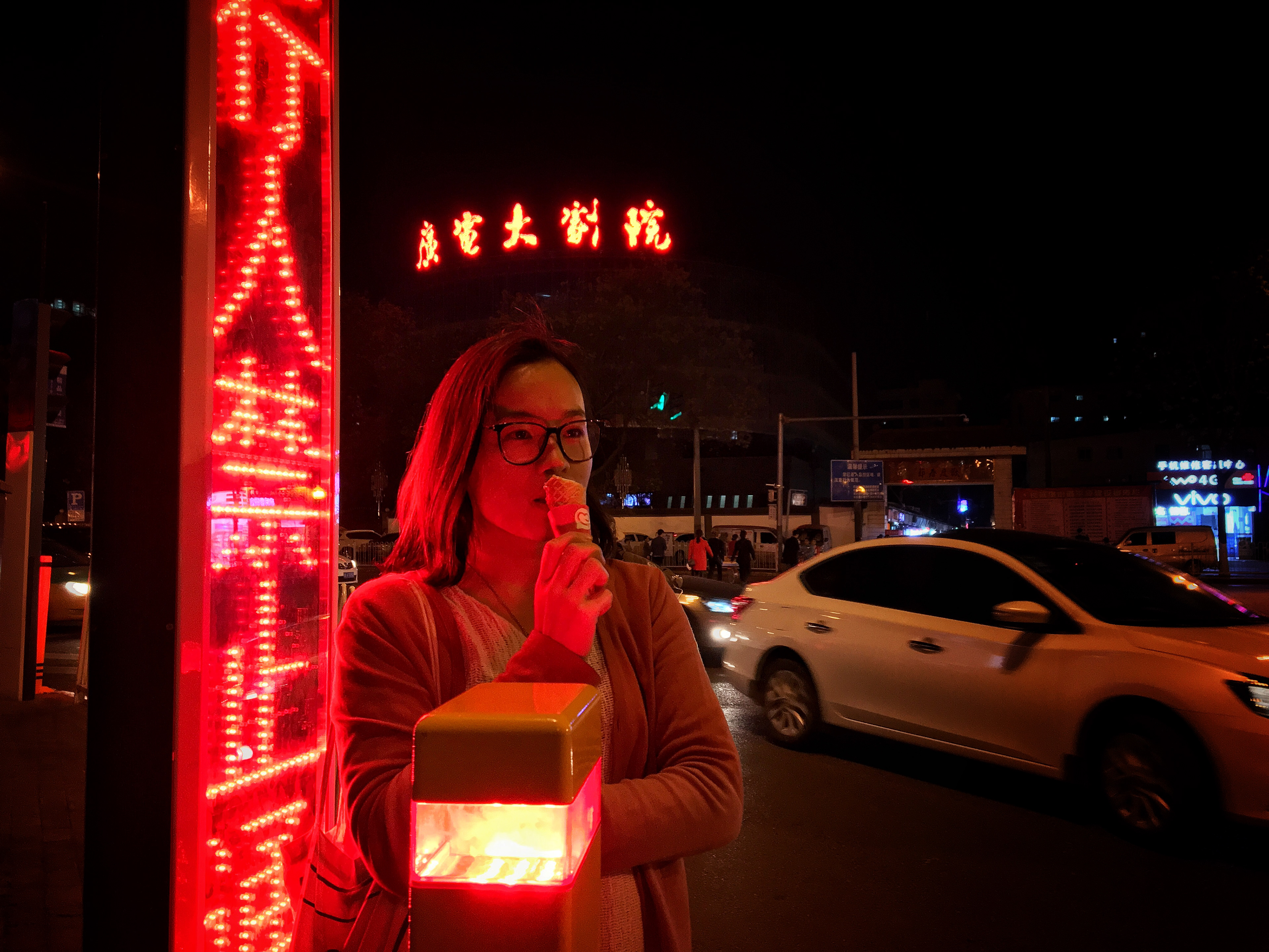 More Red China: It is not a joke. Nor is it difficult to capture. This place is oddly saturated in red. Here @solitudennature waits for a crosswalk bathed in the redness of China.