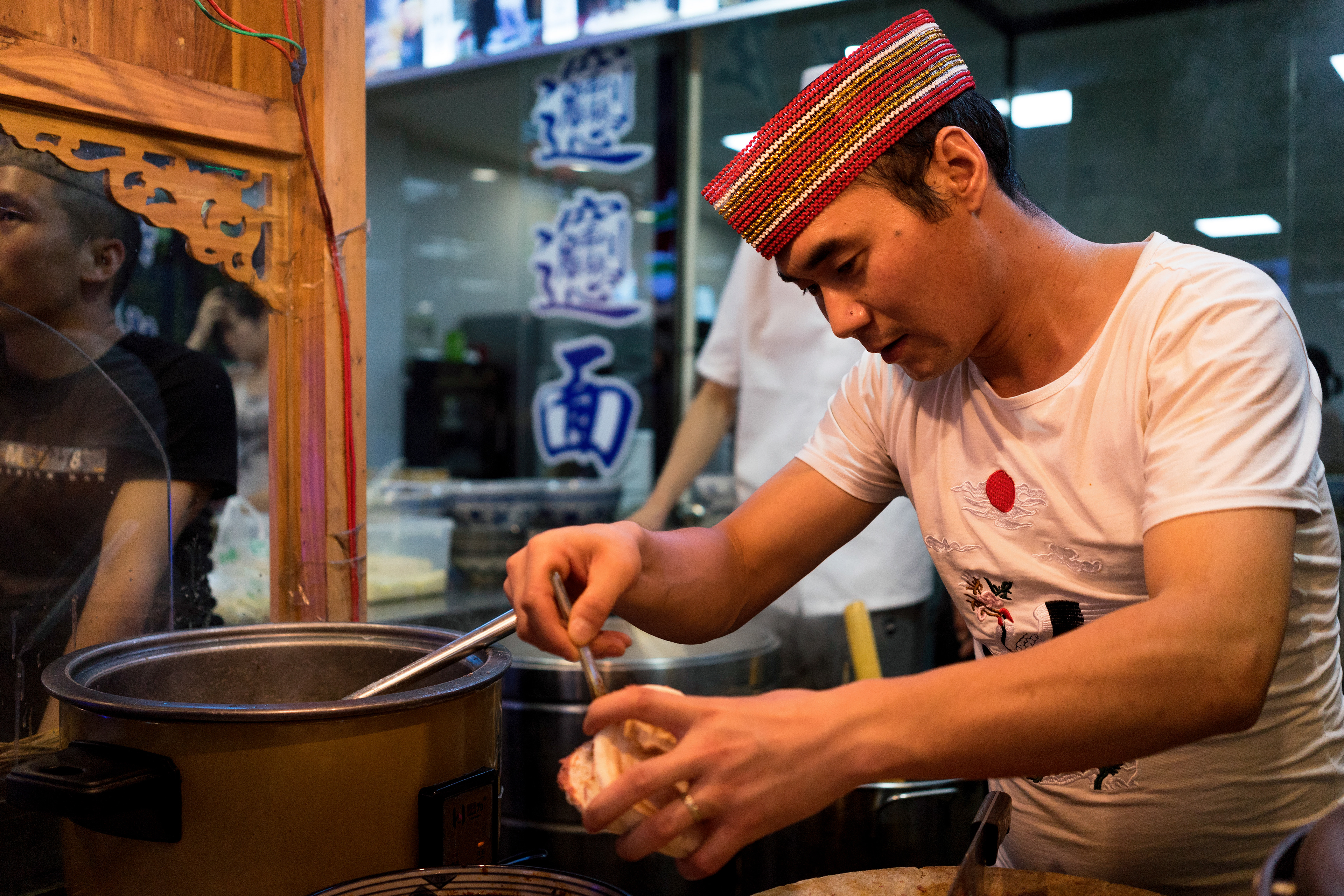 Rou Jia Mo: A Muslim man, an hour before the call to prayer, makes a delicious Chinese hamburger known as Rou Jia Mo.