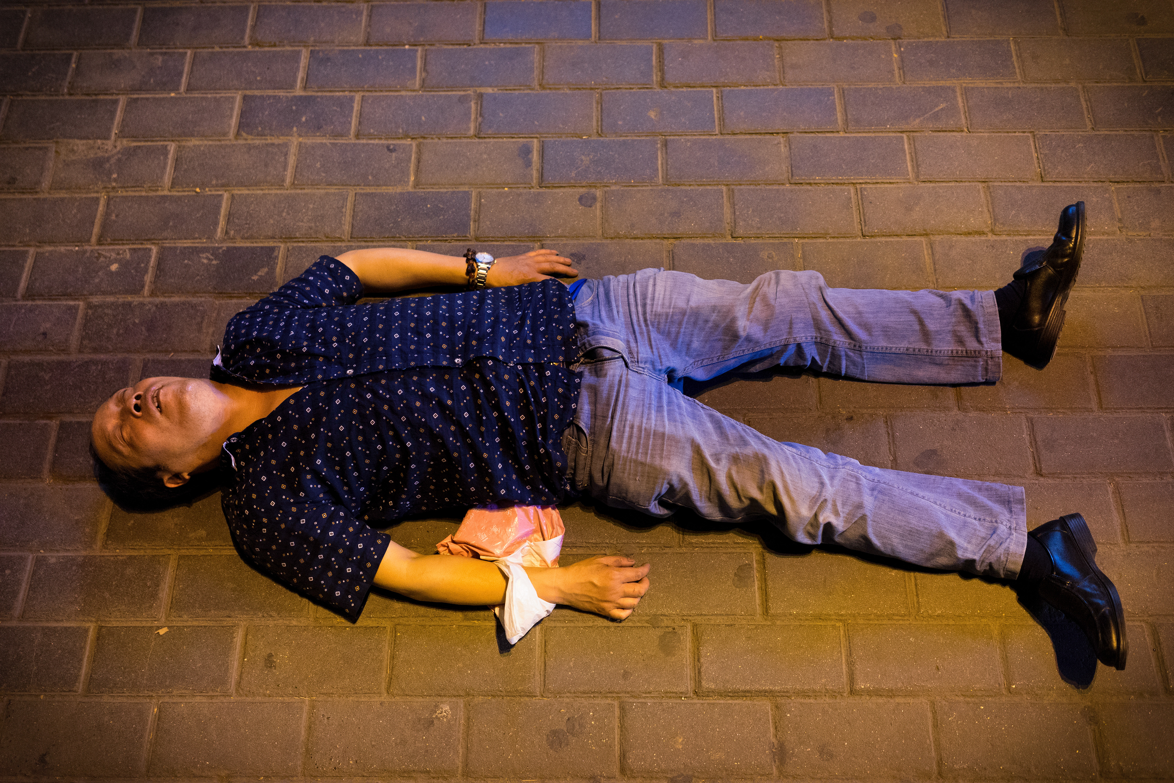 Drunk? Dead? Hard to say...It's Friday night in Xi'an, China