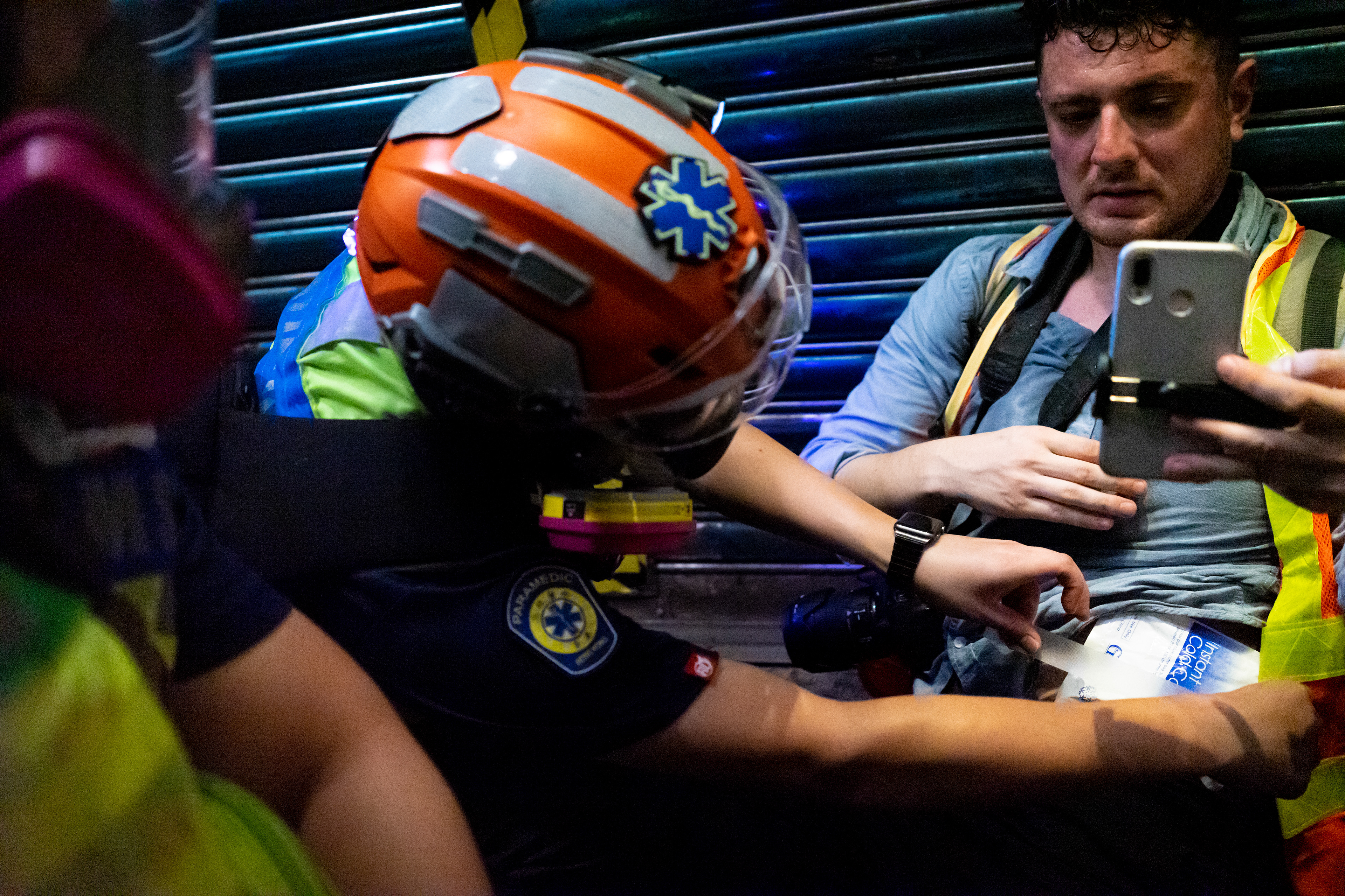 Rubber Bullet: Causeway Bay, Hong Kong: As tear gas is fired all around us, Nok treats a reporter who was hit in the gut with a rubber bullet. Following the 5th anniversary of the Umbrella Movement, protesters encounter violence from police on a scale that has not been seen before. September 29, 2019-Hong Kong
