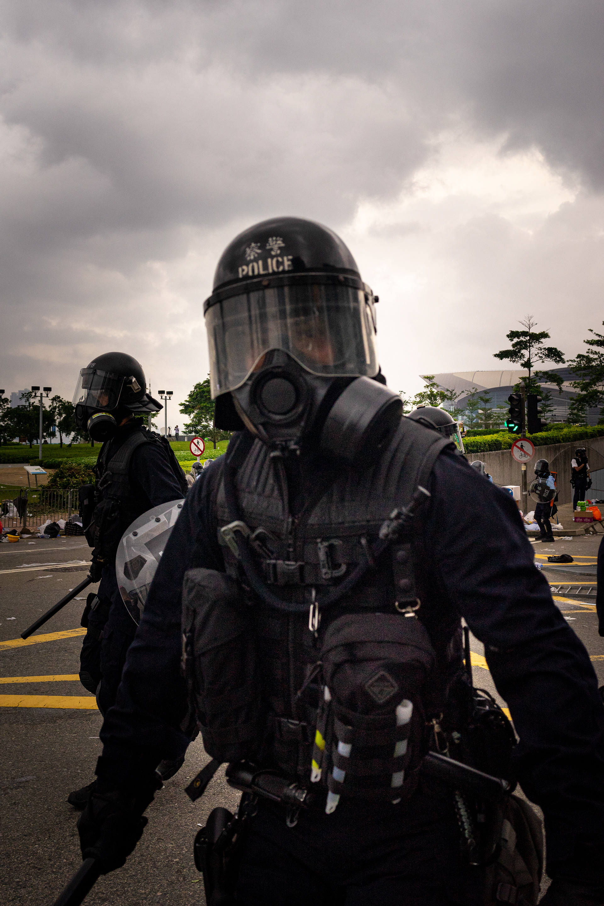 A riot officer moves to direct protestors, by standers, and journalists. It appears to be a typical tactic of riot police that after a show of force, their control over the situation must be punctuated with subsequent orders. Protestors in Hong Kong take to the streets again. This time to fight a new proposed law, that would allow for Hong Kongers arrested in the city to be extradited to China.