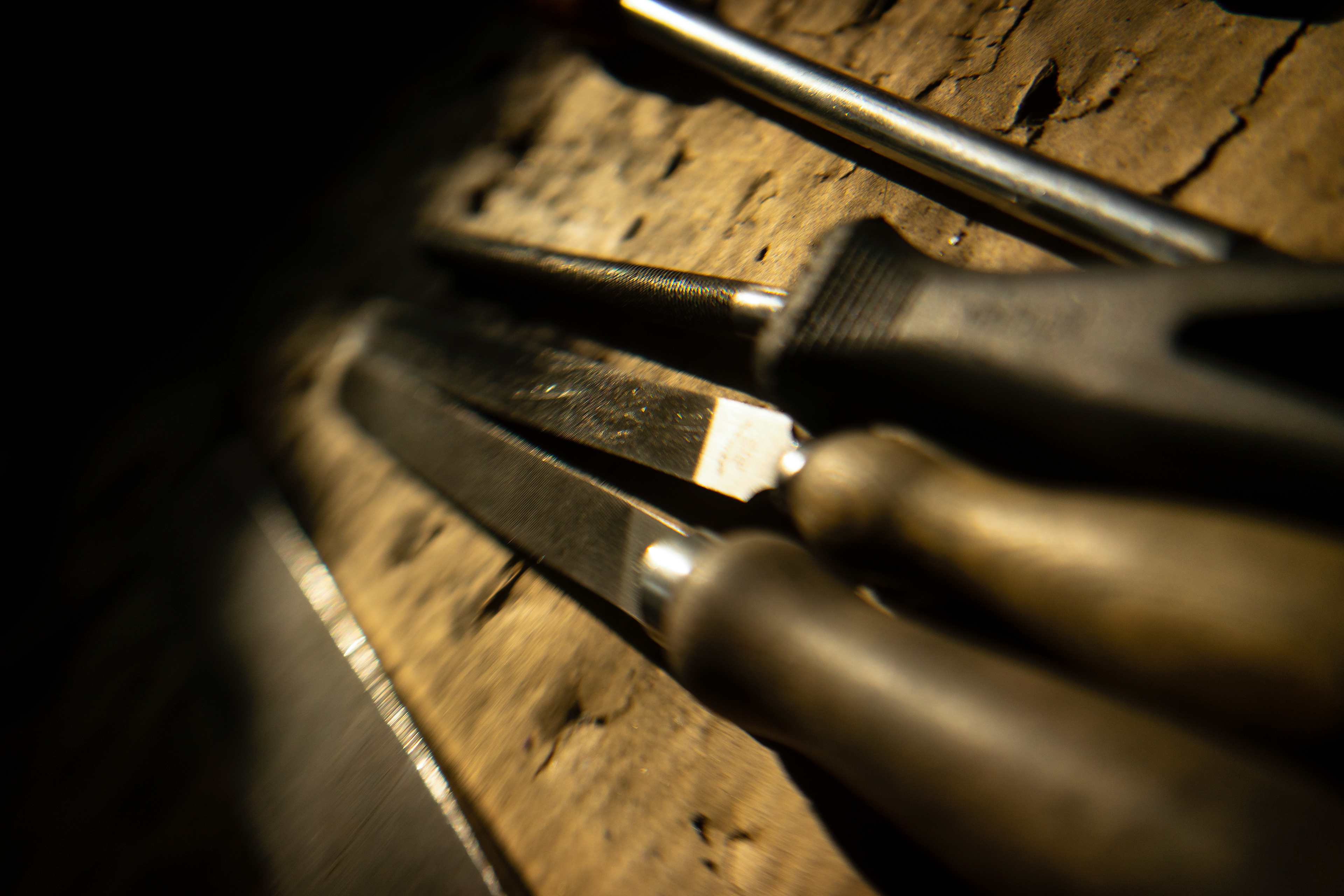 10: Magnifying Tools -Some of the tools of the trade on Gianmaria's workbench. I found the workshop to have a mix of "old fashion" tools, and new technology. A hand file that is 40 years old, is used as readily as a brand new sand blasting booth.