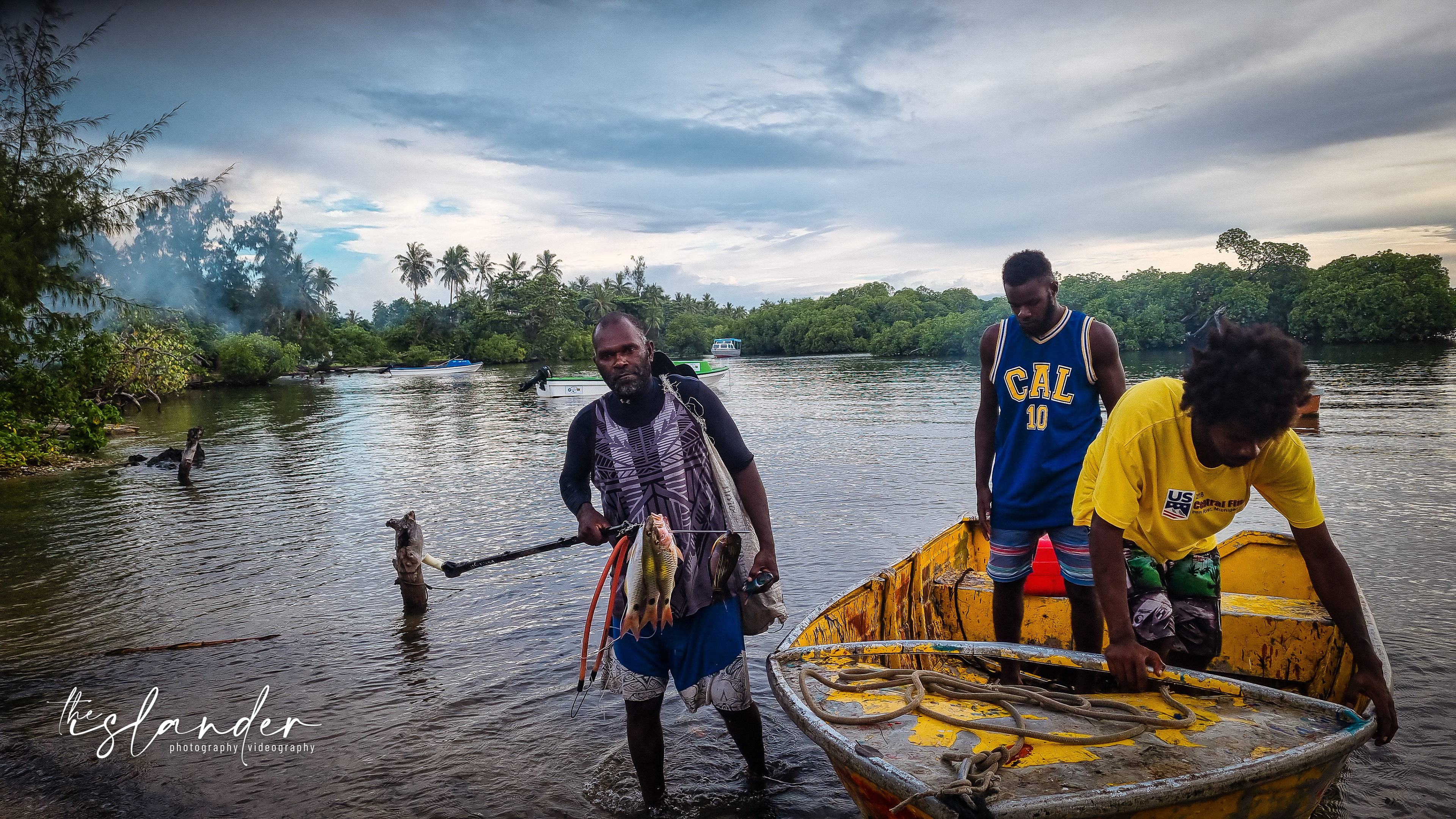 Robert coming back with the fish he caught on the reef