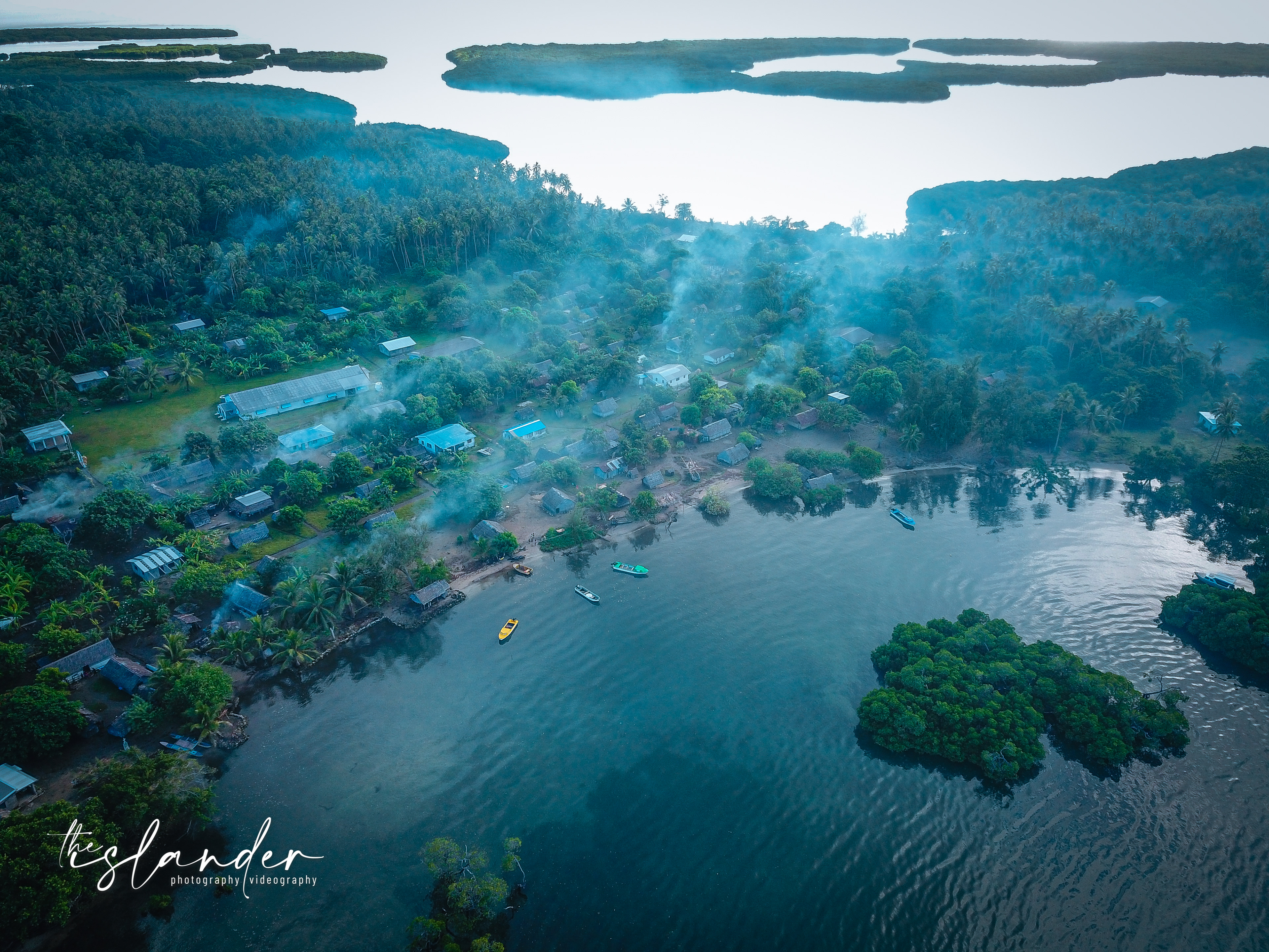 Sunday morning sunrise on the village... Smoke coming out of all bush kitchens in the village, laplap prepartion for after church service