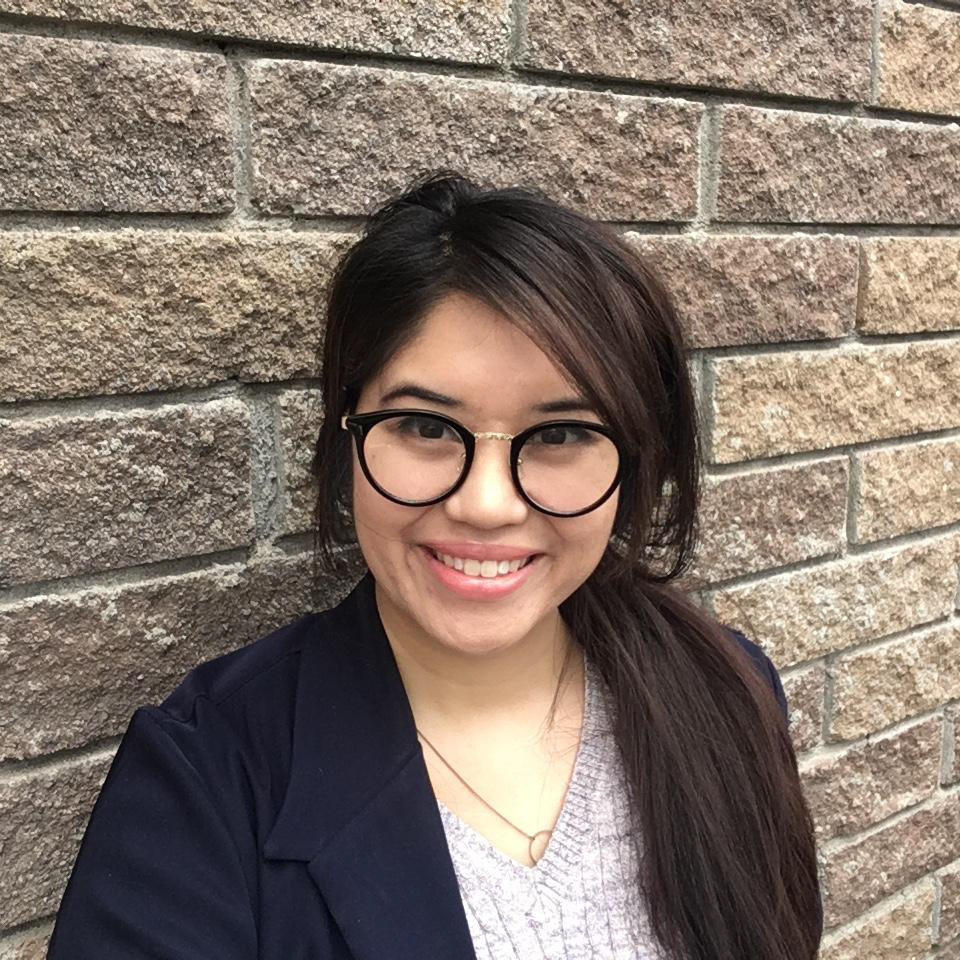 Graphic: a photo of Alannah against a brick background