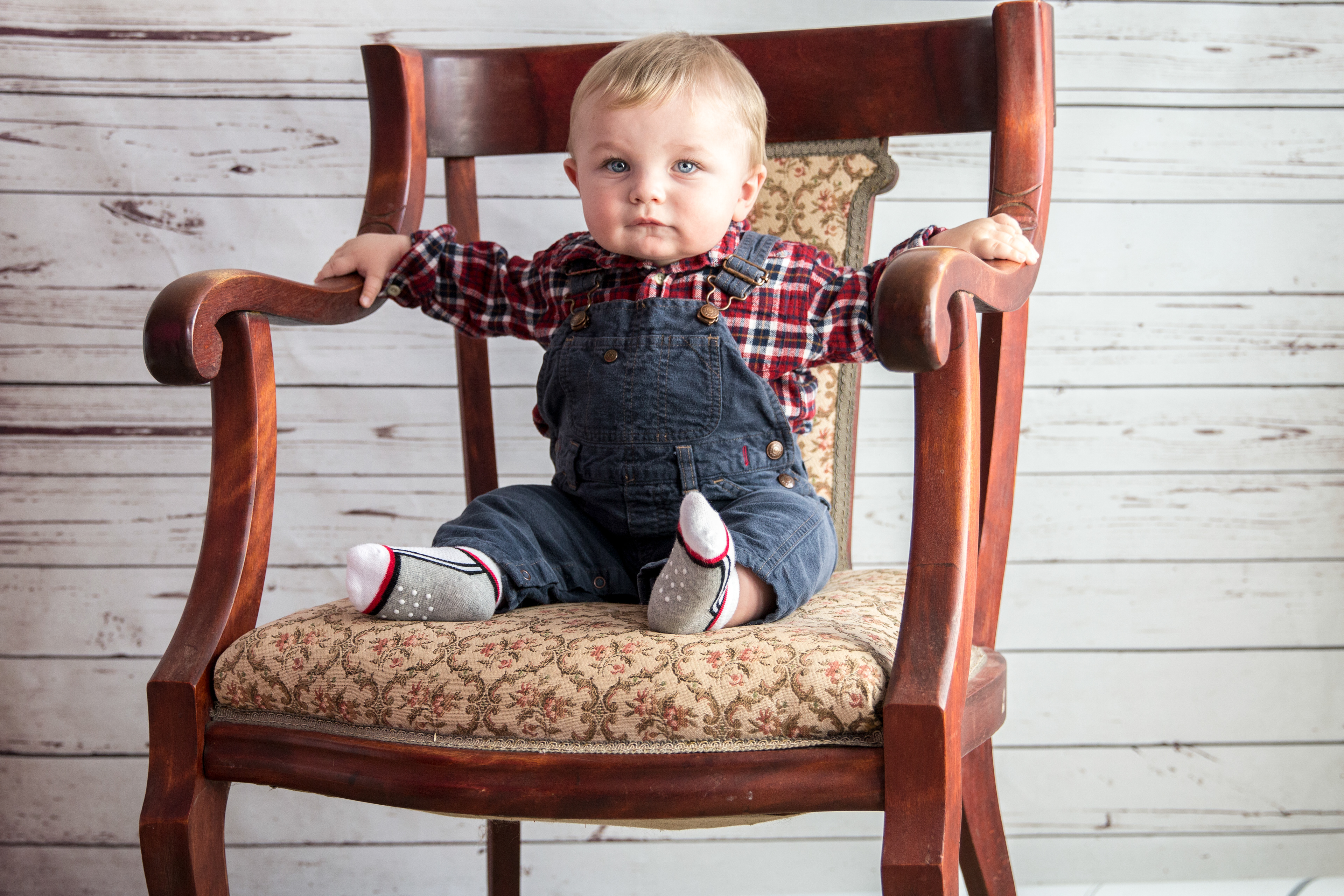 little boy sitting in a big chair