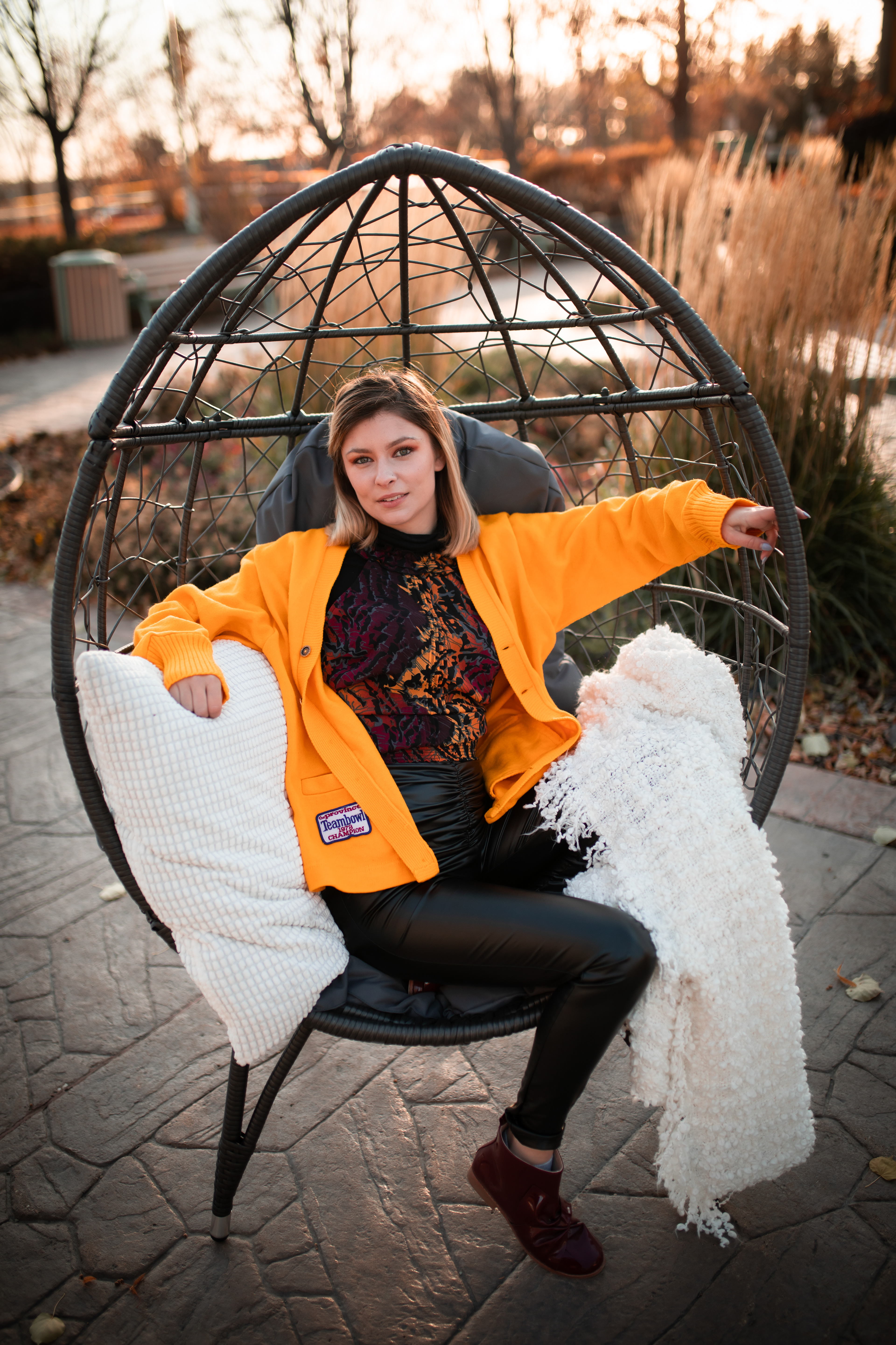 girl comfy in an egg chair 