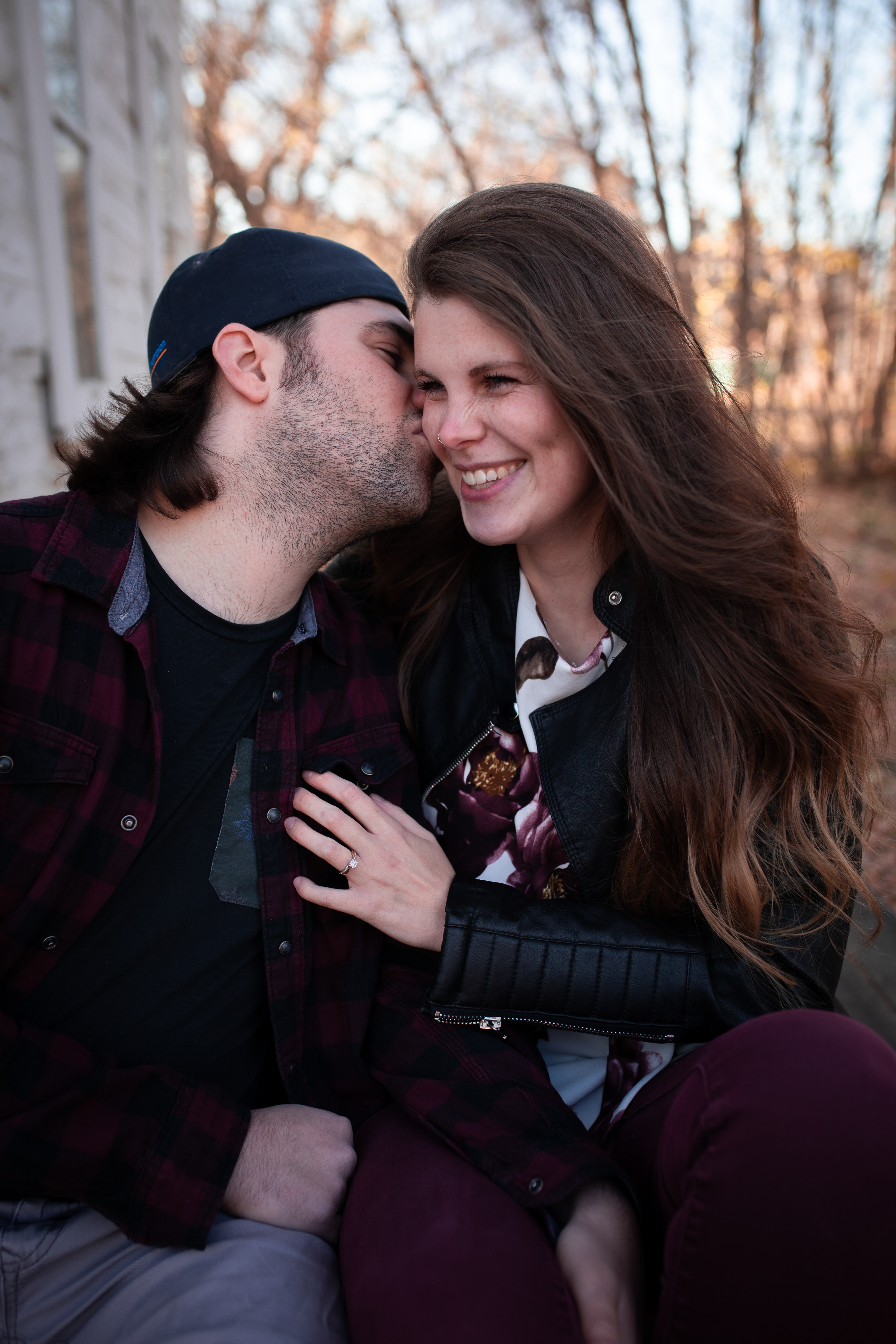 boyfriend kissing girl friends making her laugh Edmontons best engagement photographer