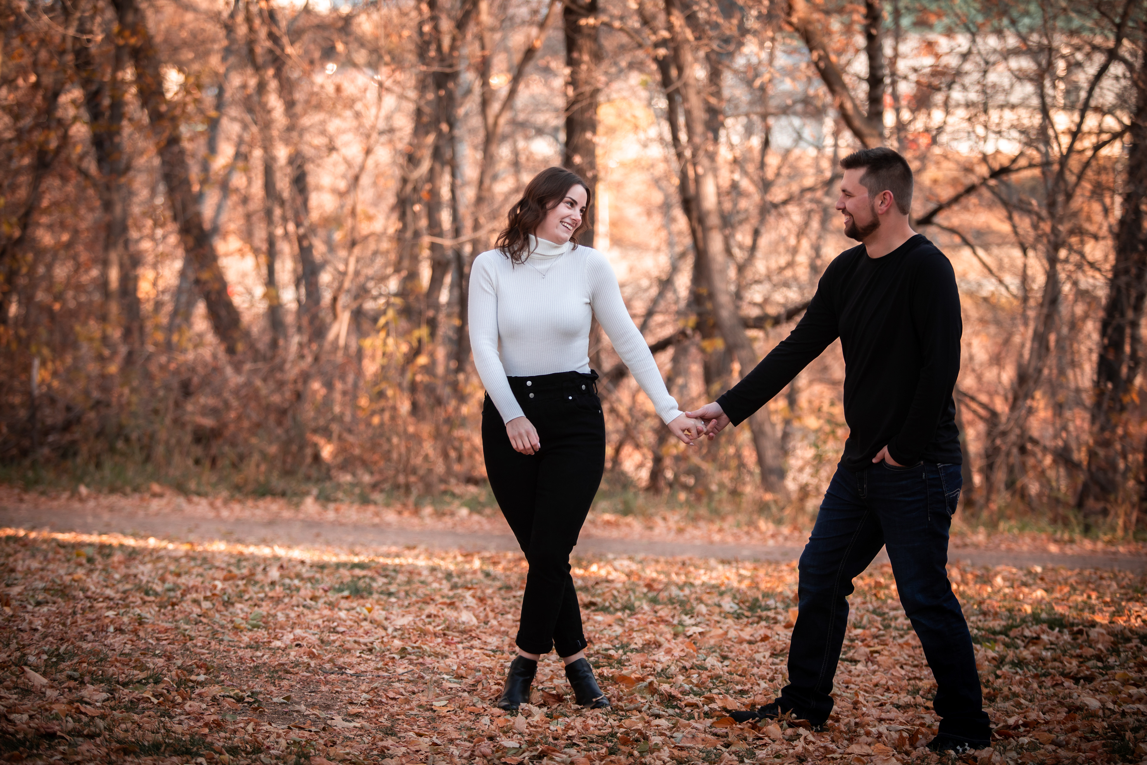 couple walking and laughing Edmontons best engagement photographer