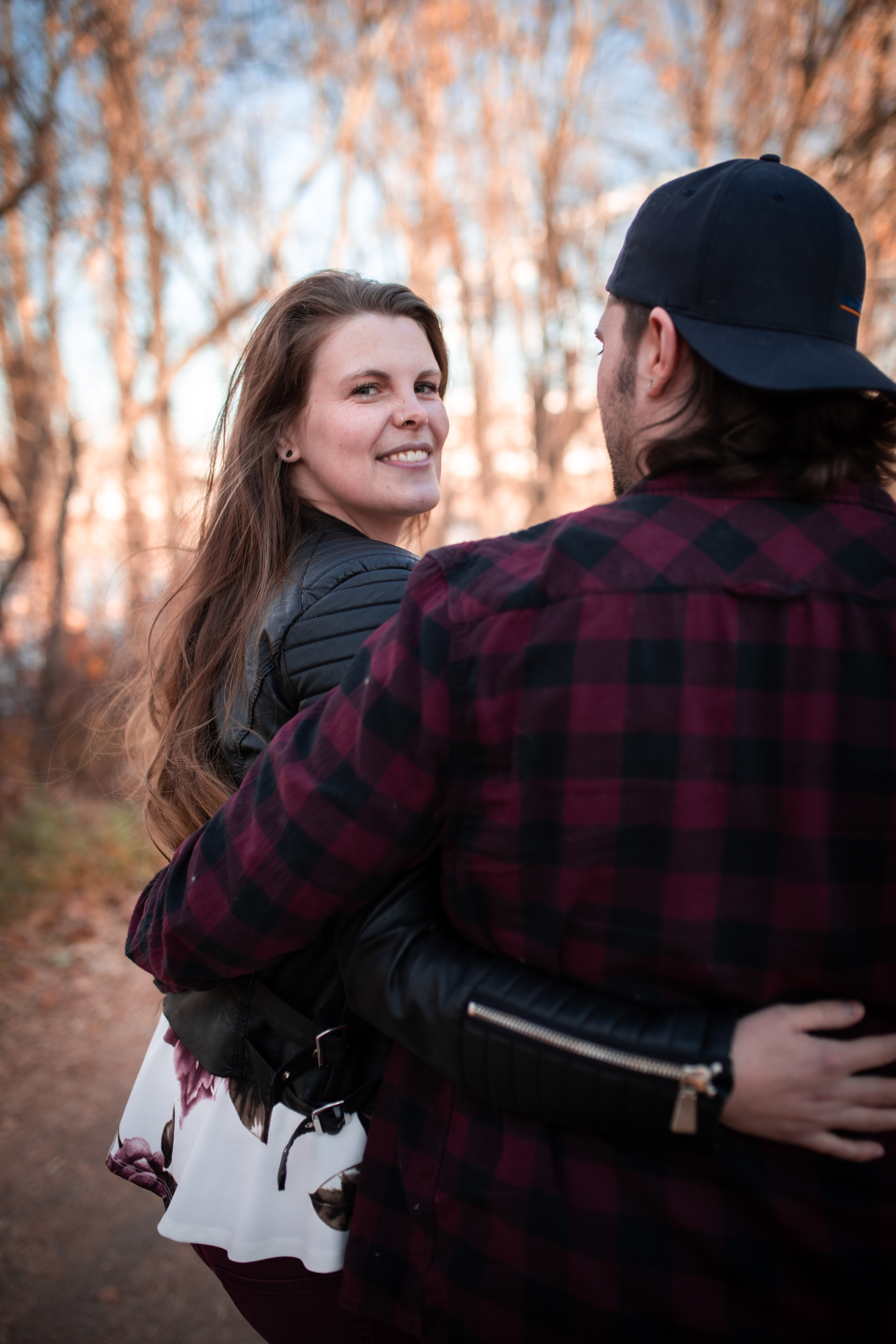 couple walking and girlfriend looking back Edmontons best engagement photographer