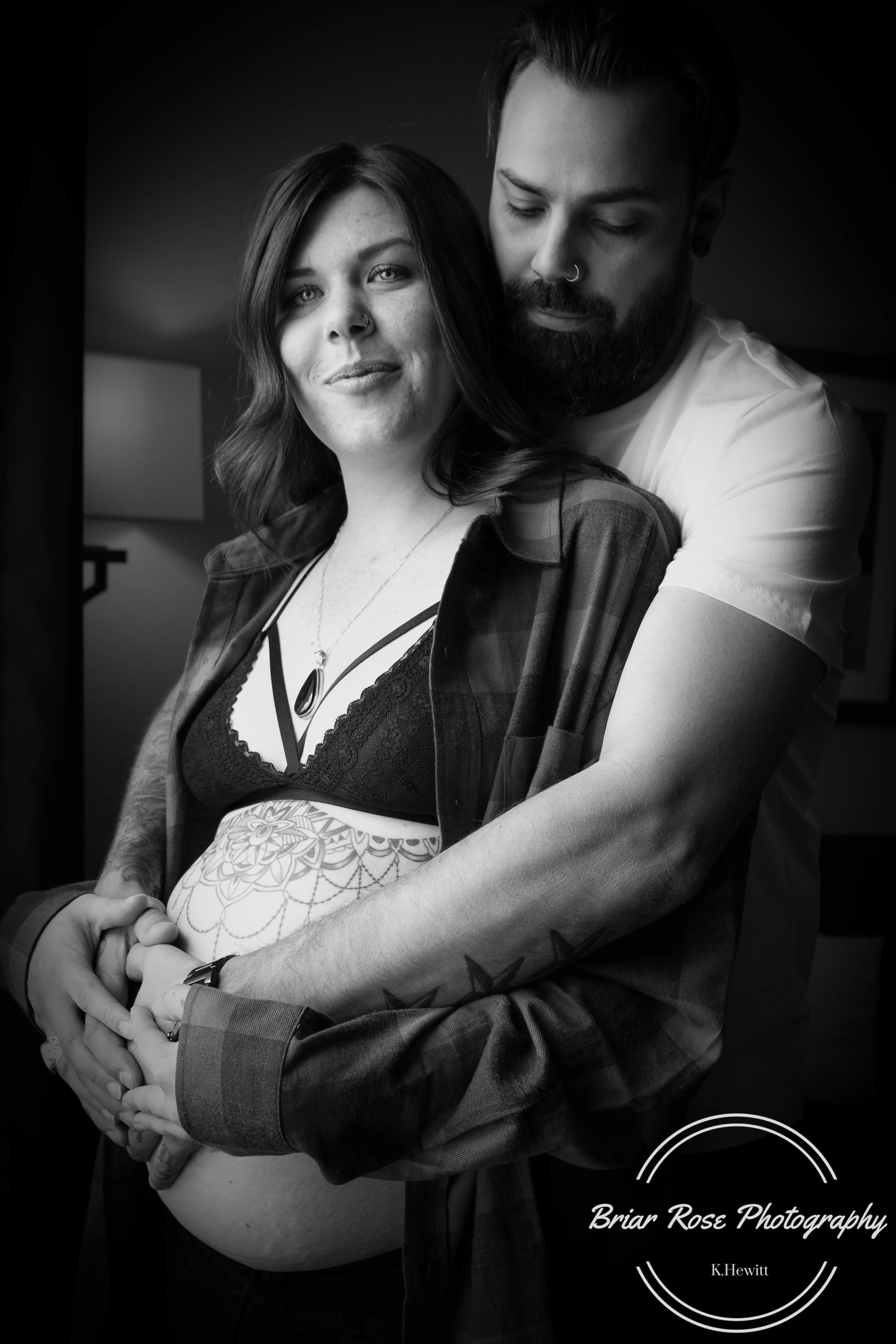 mom and dad with baby belly