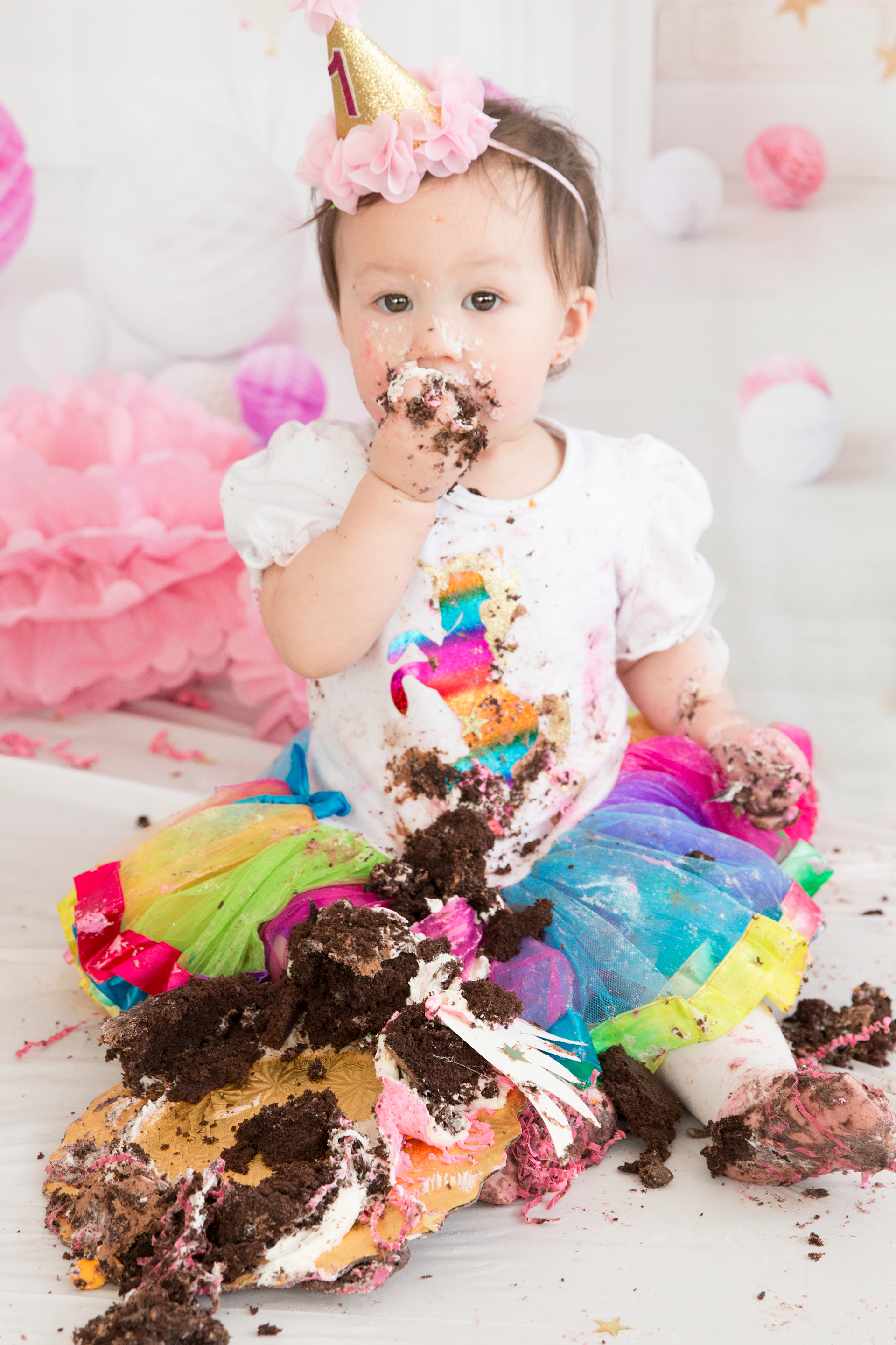 baby covered in cake 