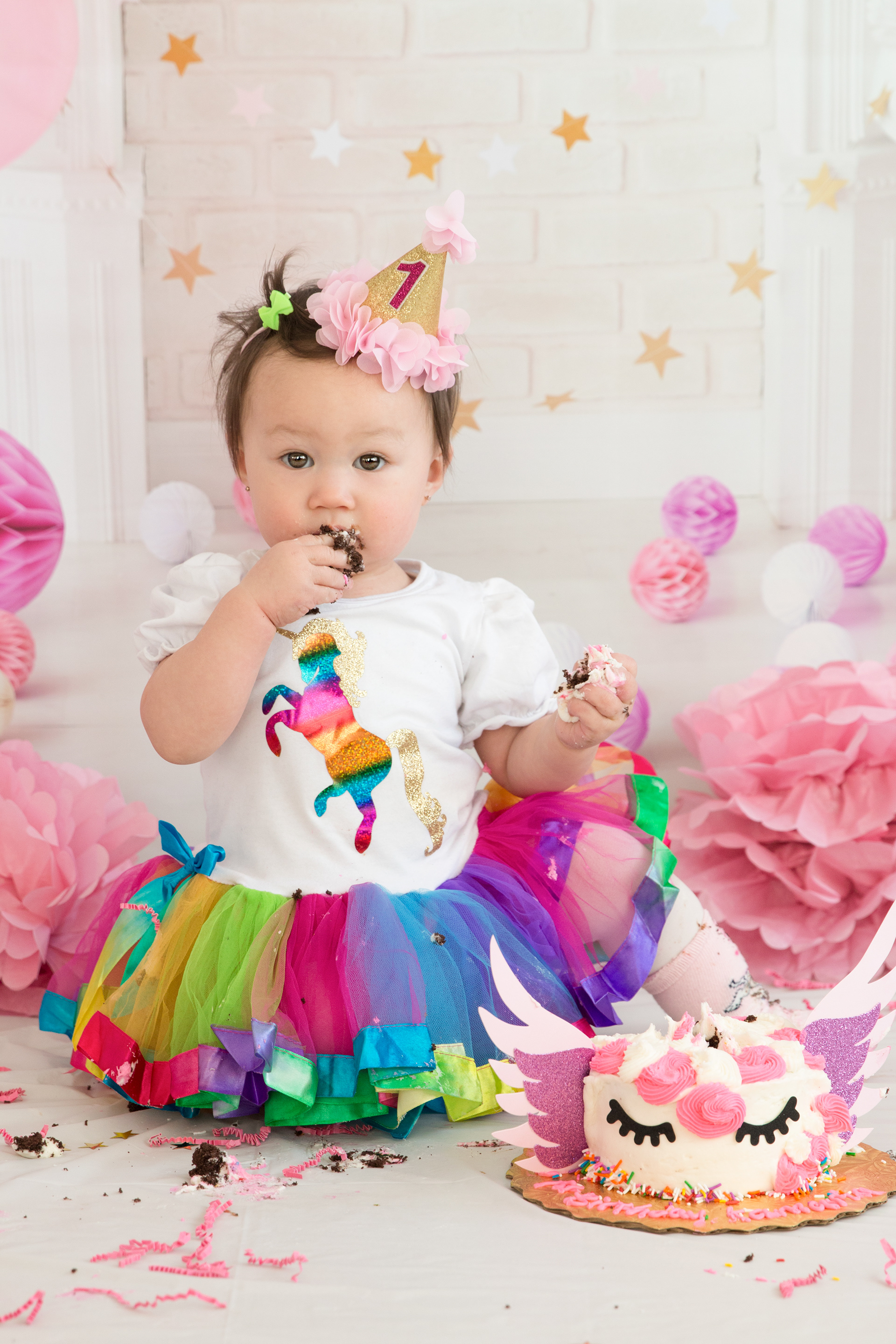 baby surprised eating cake