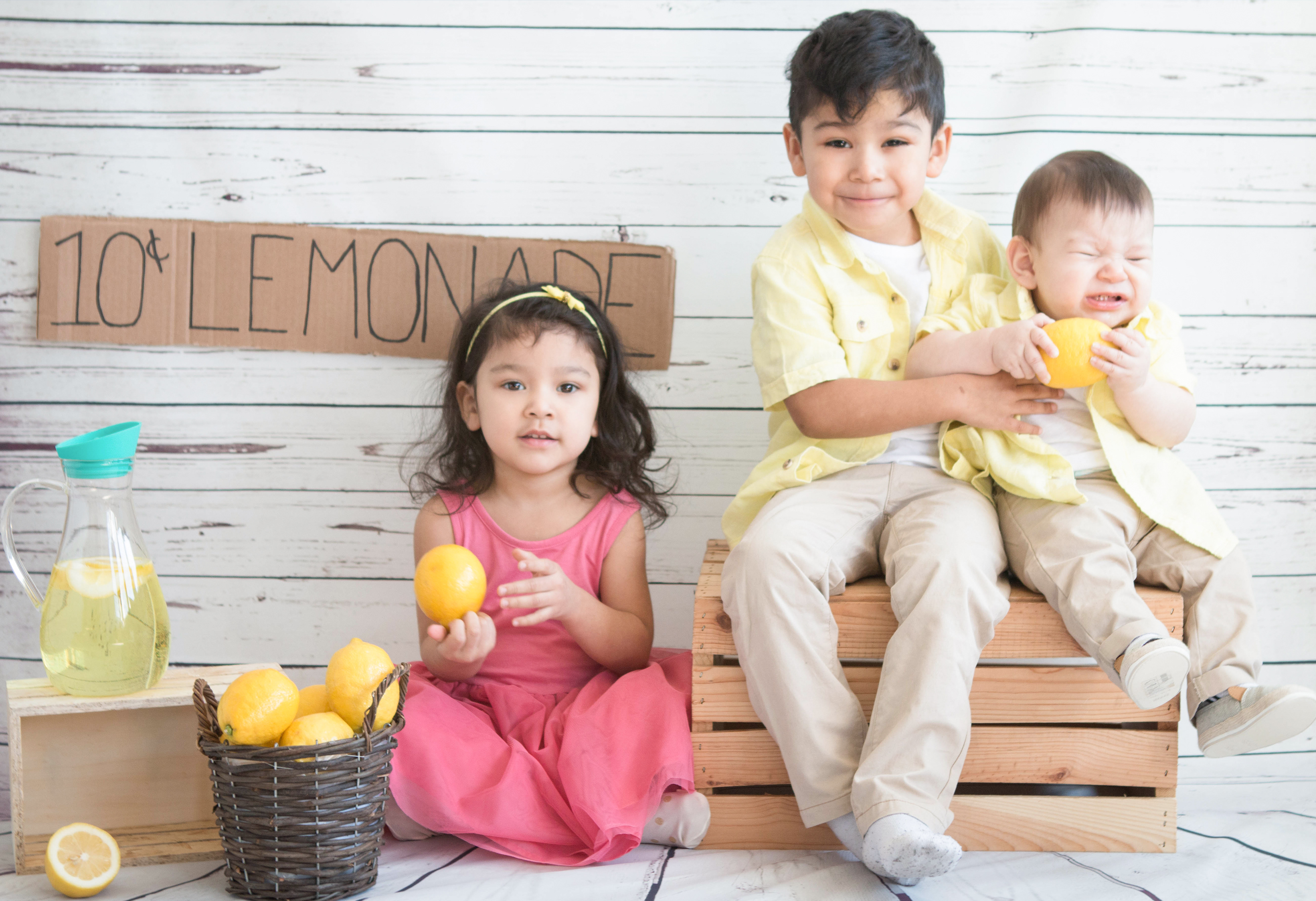 lemonade stand back drop with three kids