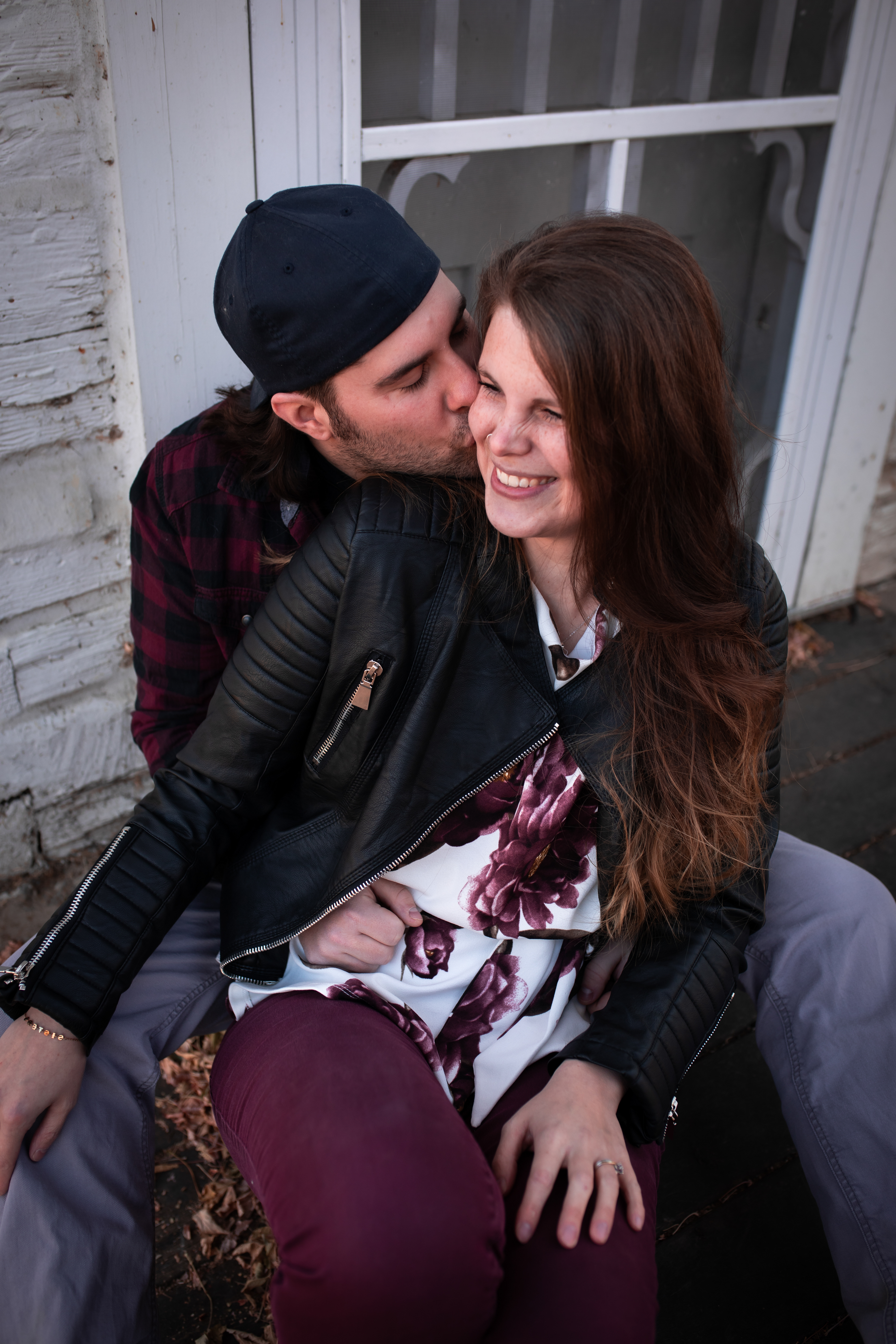 cuddled up couple Edmontons best engagement photographer