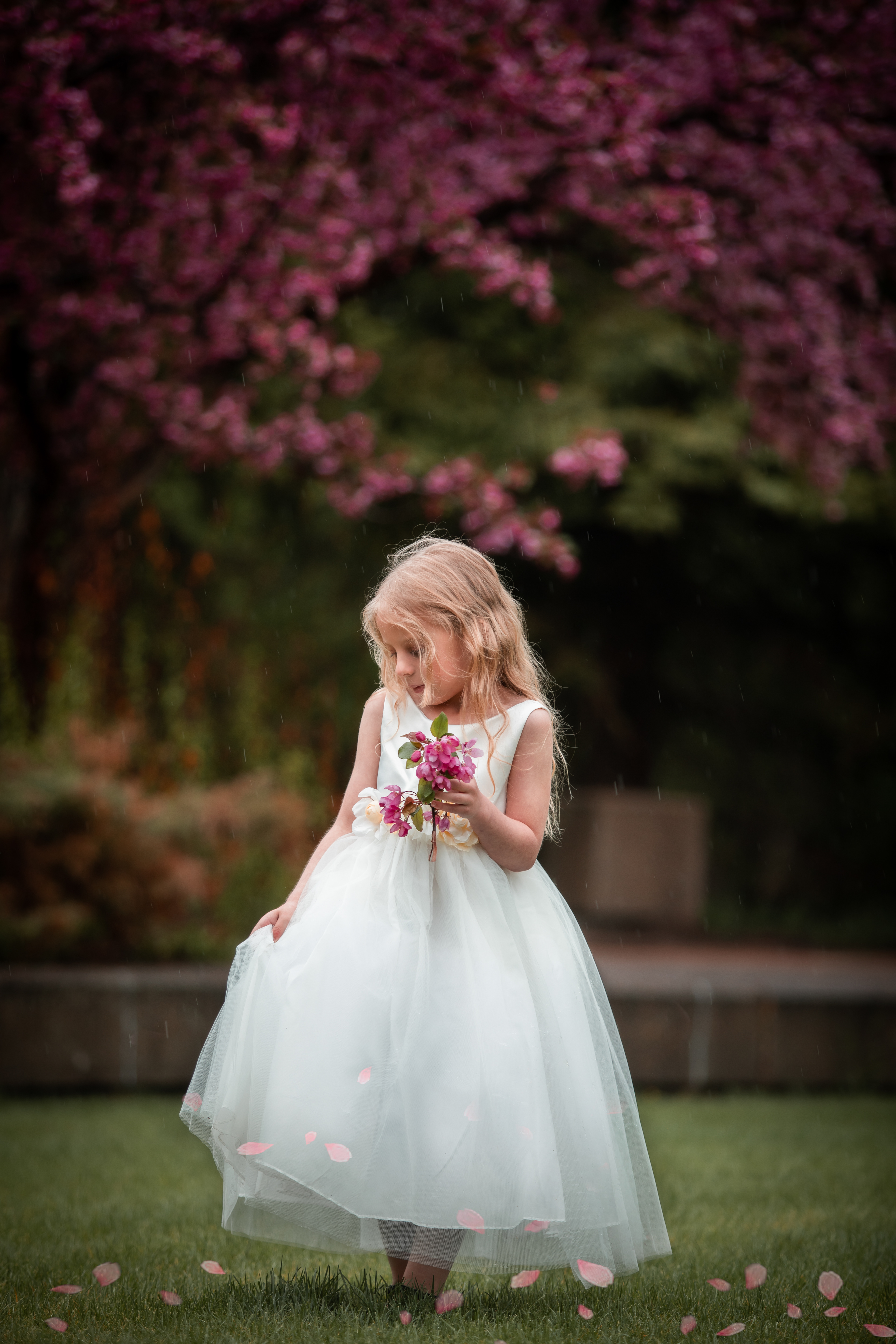 little girl smelling the slowers