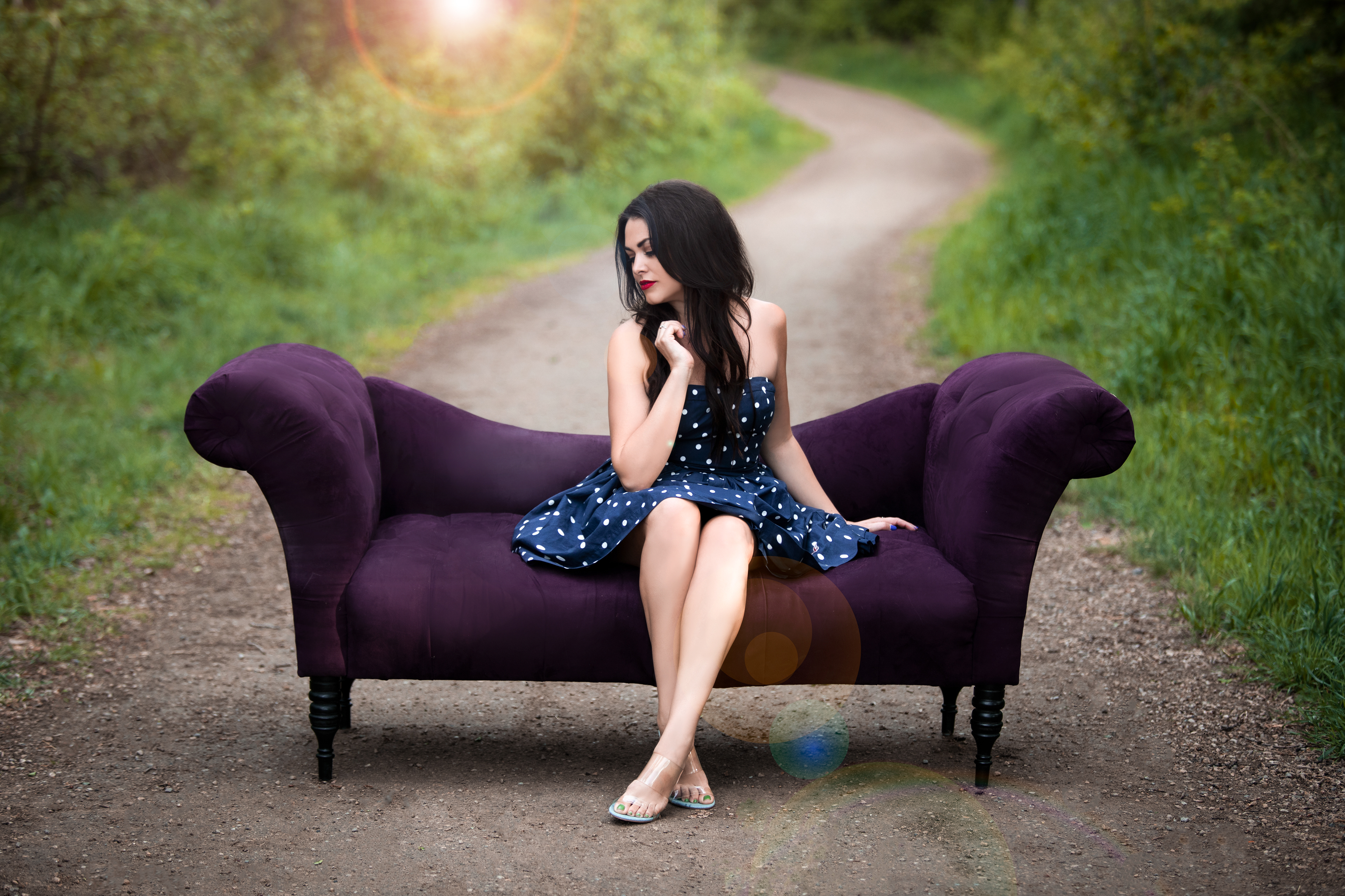 model on a couch outside